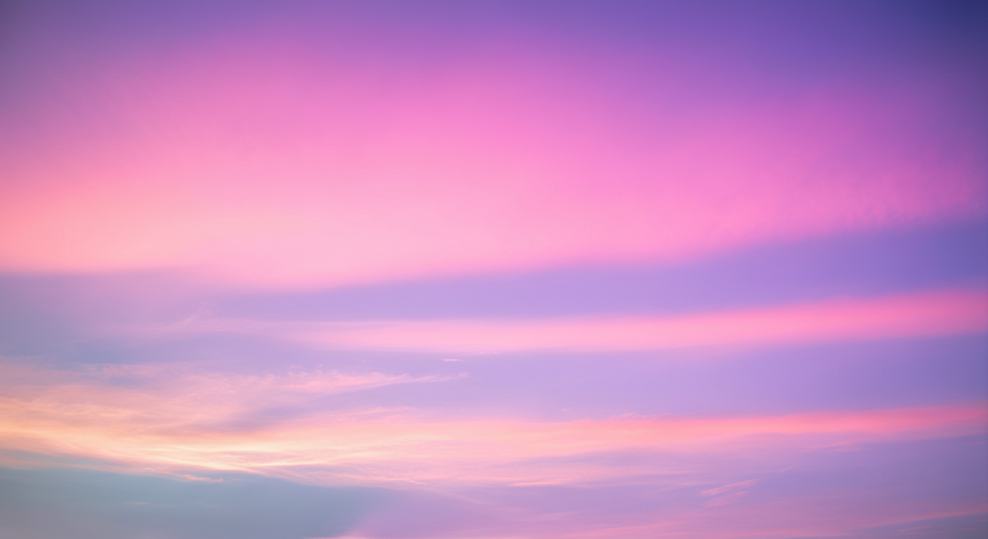 Colorful sky with pink, purple, and blue clouds at sunset or sunrise.