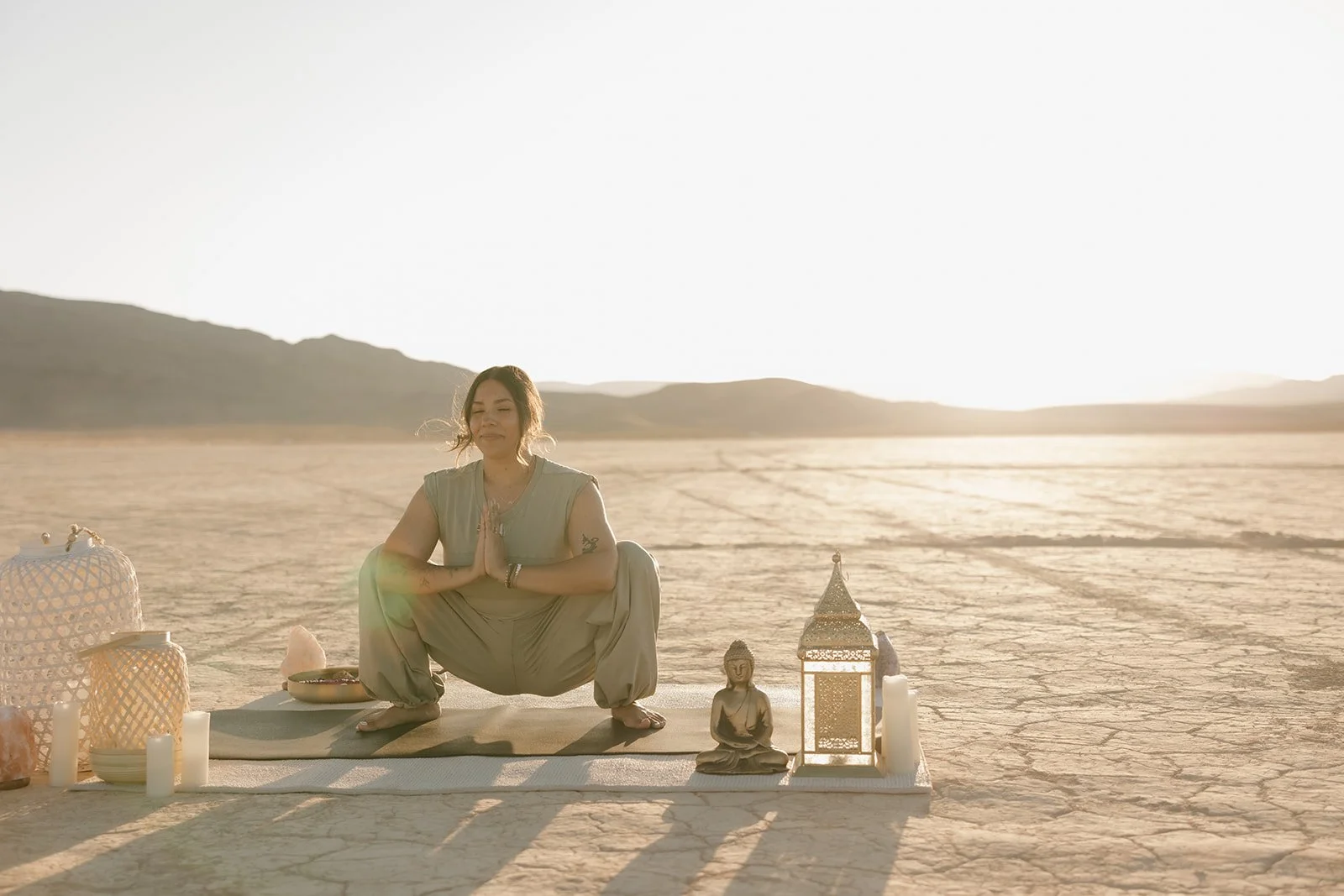 Trauma therapist practicing a grounding yoga pose in the Nevada desert, representing mindfulness, emotional balance, flexibility, and the Buddhist Middle Way.