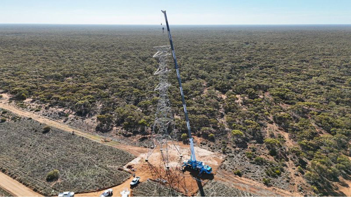 Image of a crane beside a transmission line in regional NSW