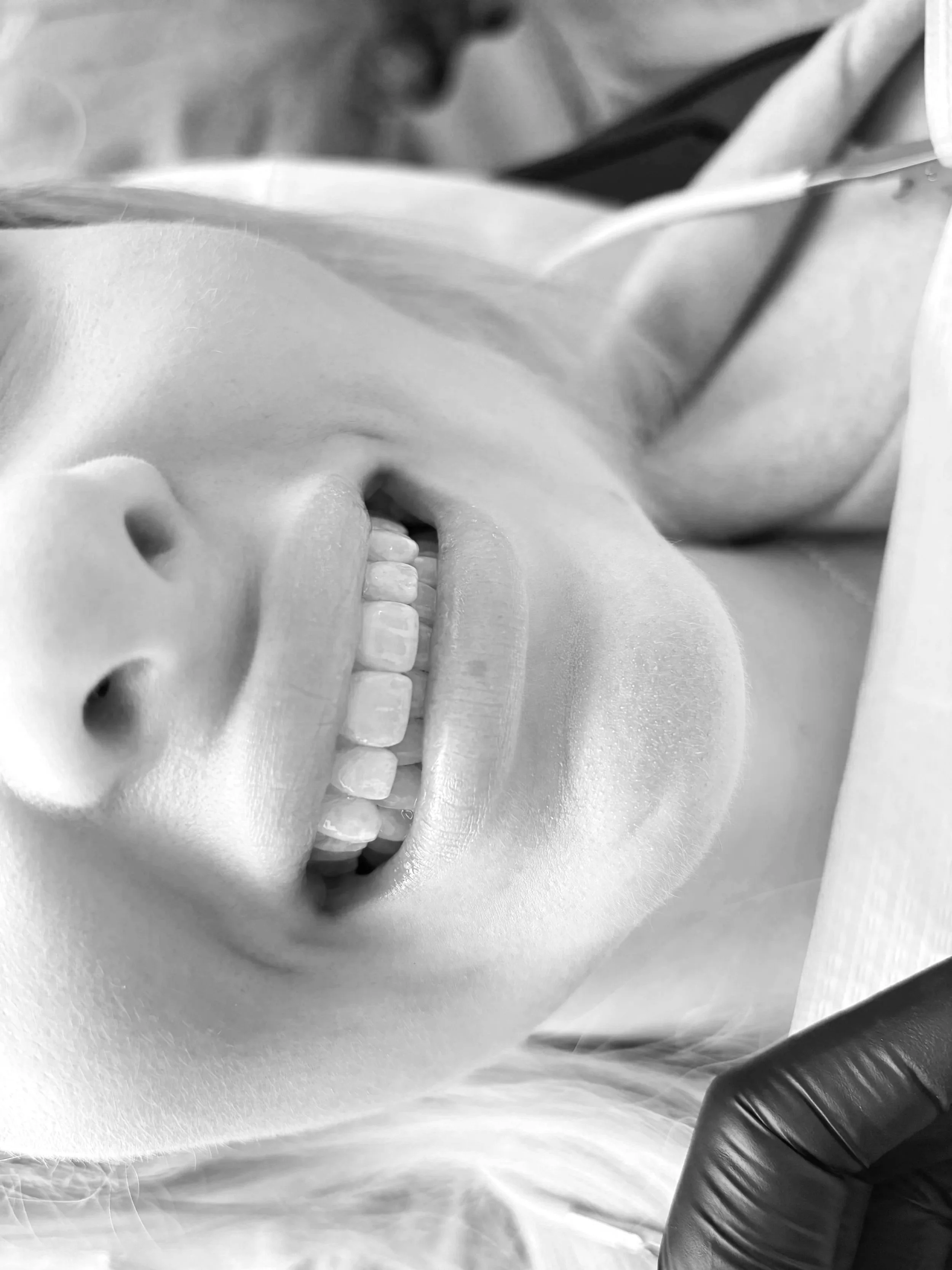Girl smiling after having cosmetic teeth whitening in a luxurious clinic