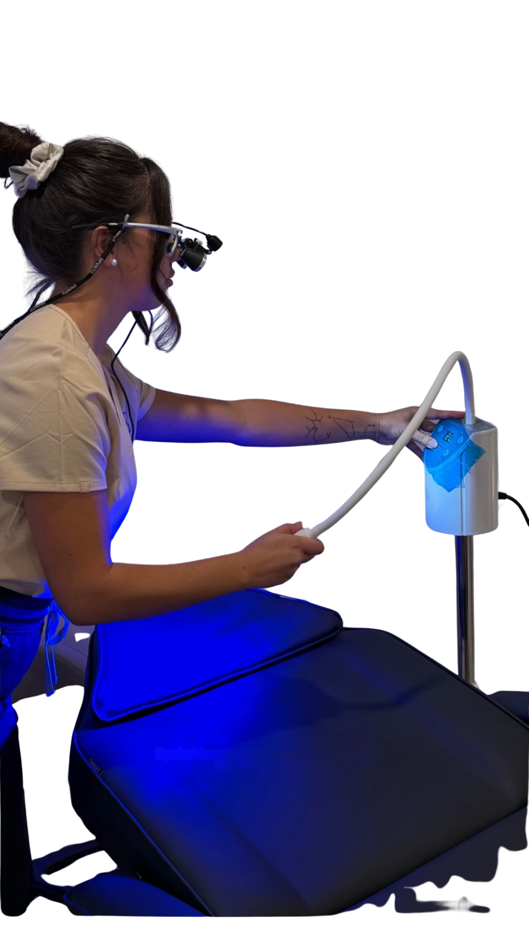 smile by ell dental nurse and owner ell setting up the LED for cosmetic teeth whitening in her clinic.