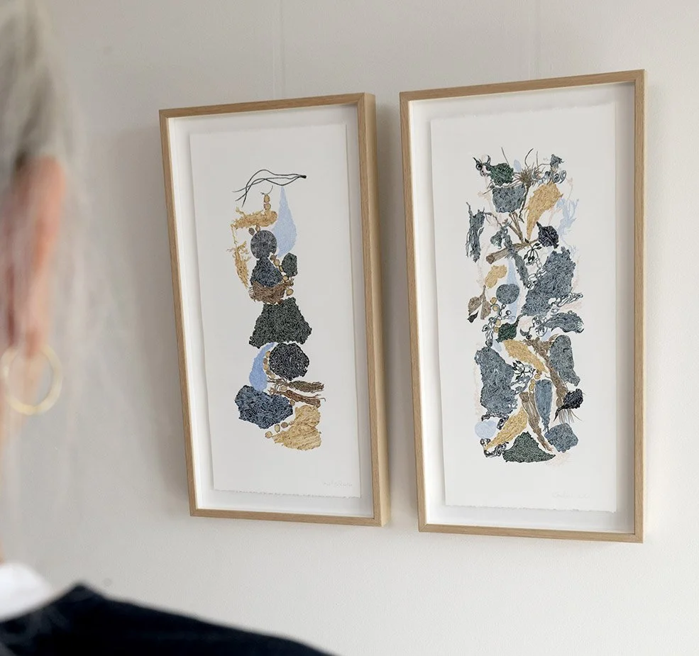 Two framed works from Clare Bell's seeking inspiration series hung side by side