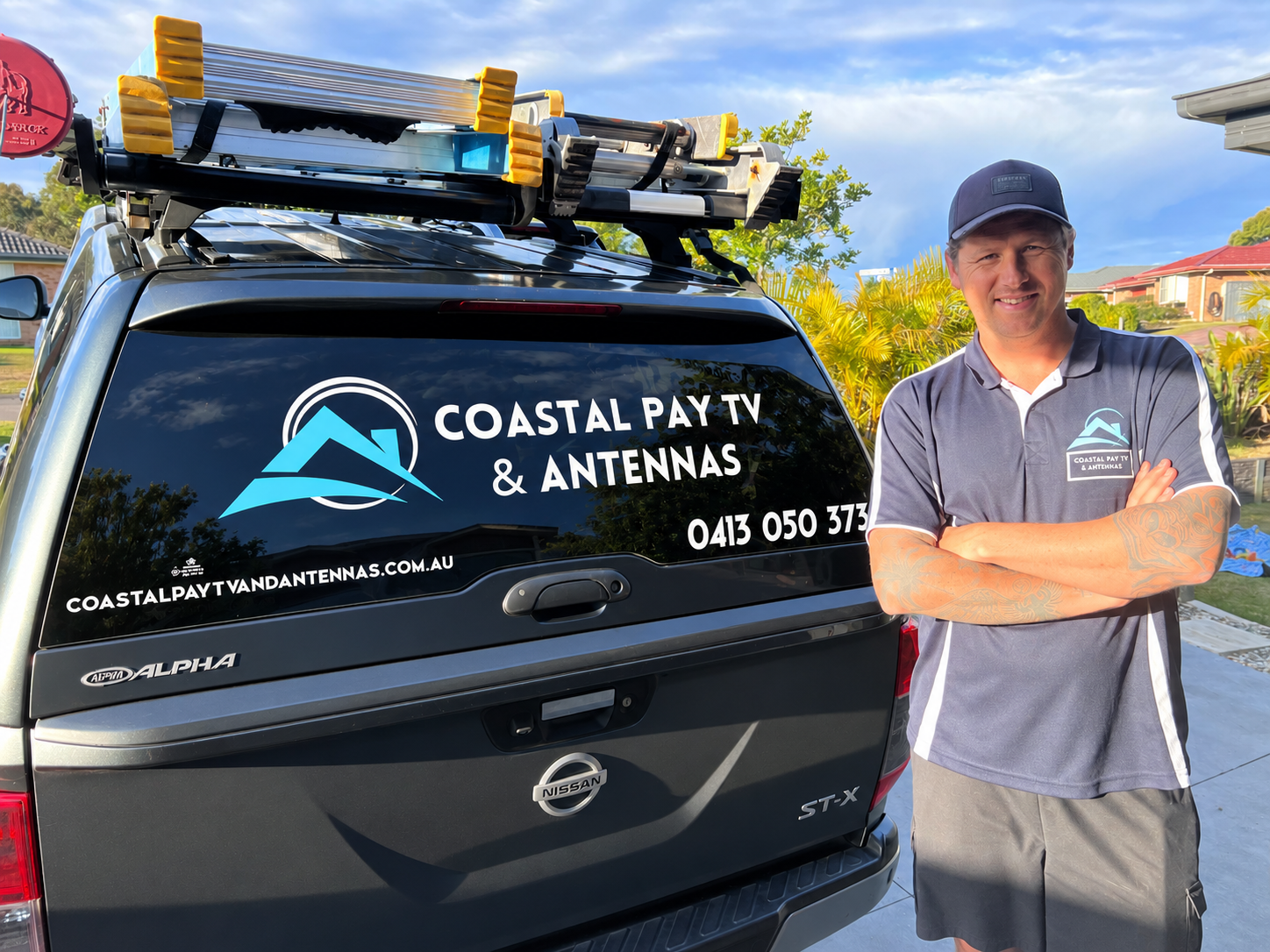 Professional TV antenna installer working on a residential roof in Central Coast NSW