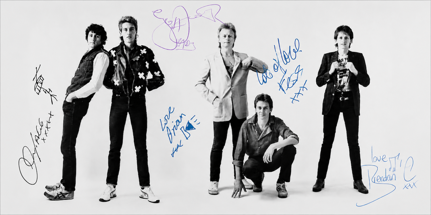 The Radiators promotional band banner image with signatures added by the original lineup. 