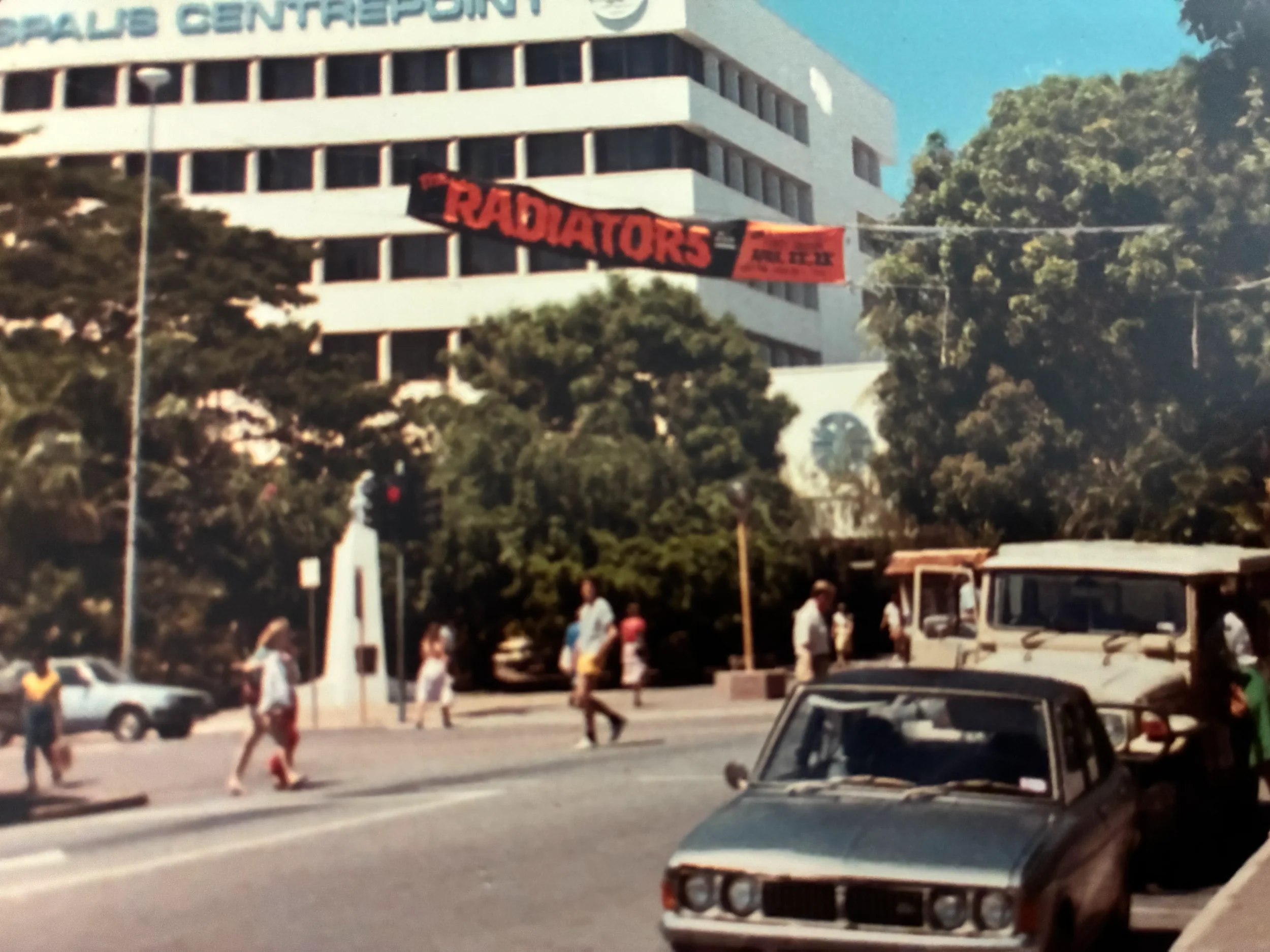 The Radiators play Darwin, circa 1985. That's Brian crossing the street, under the banner