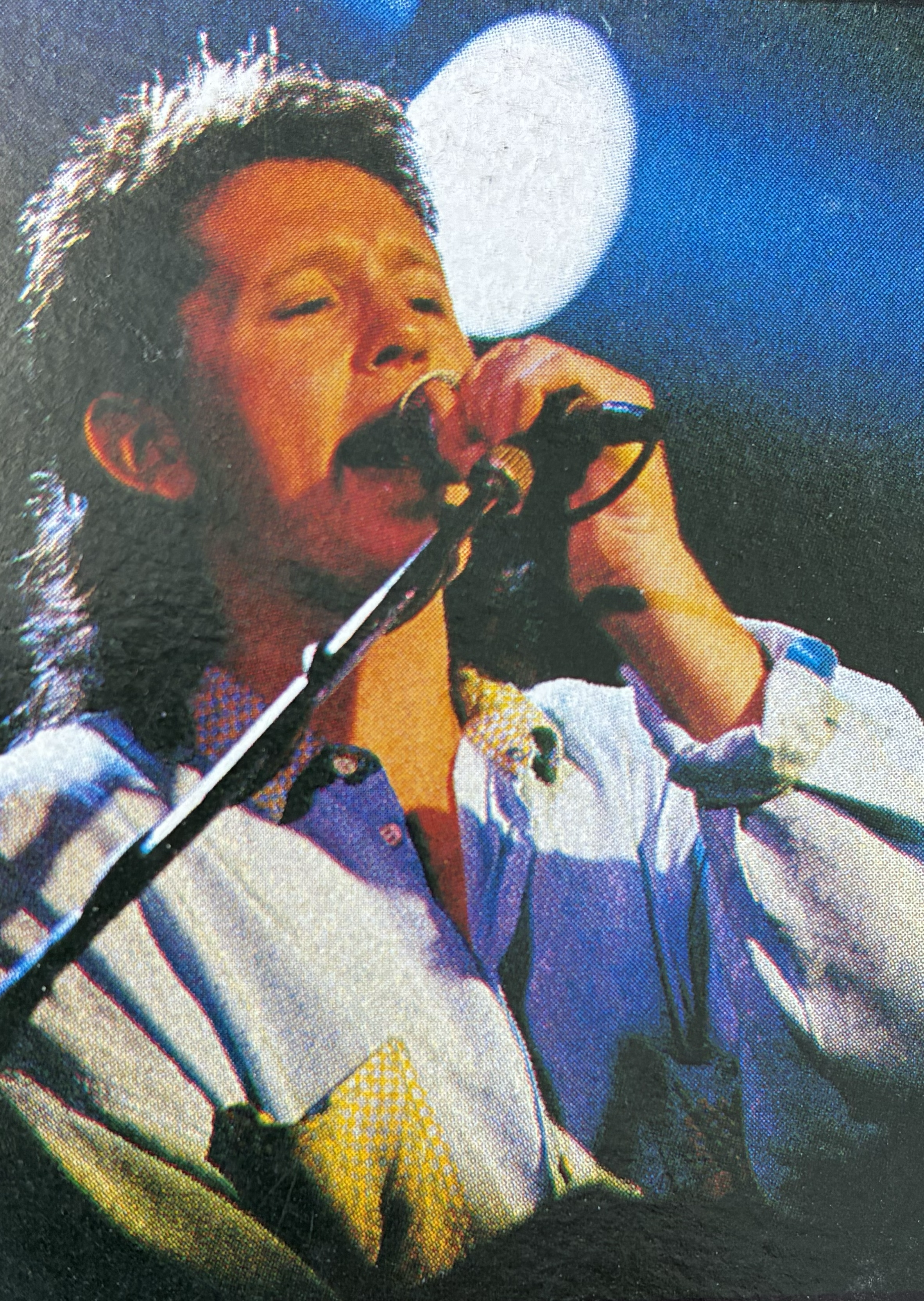The live action shot from the back cover of Gimme....Live