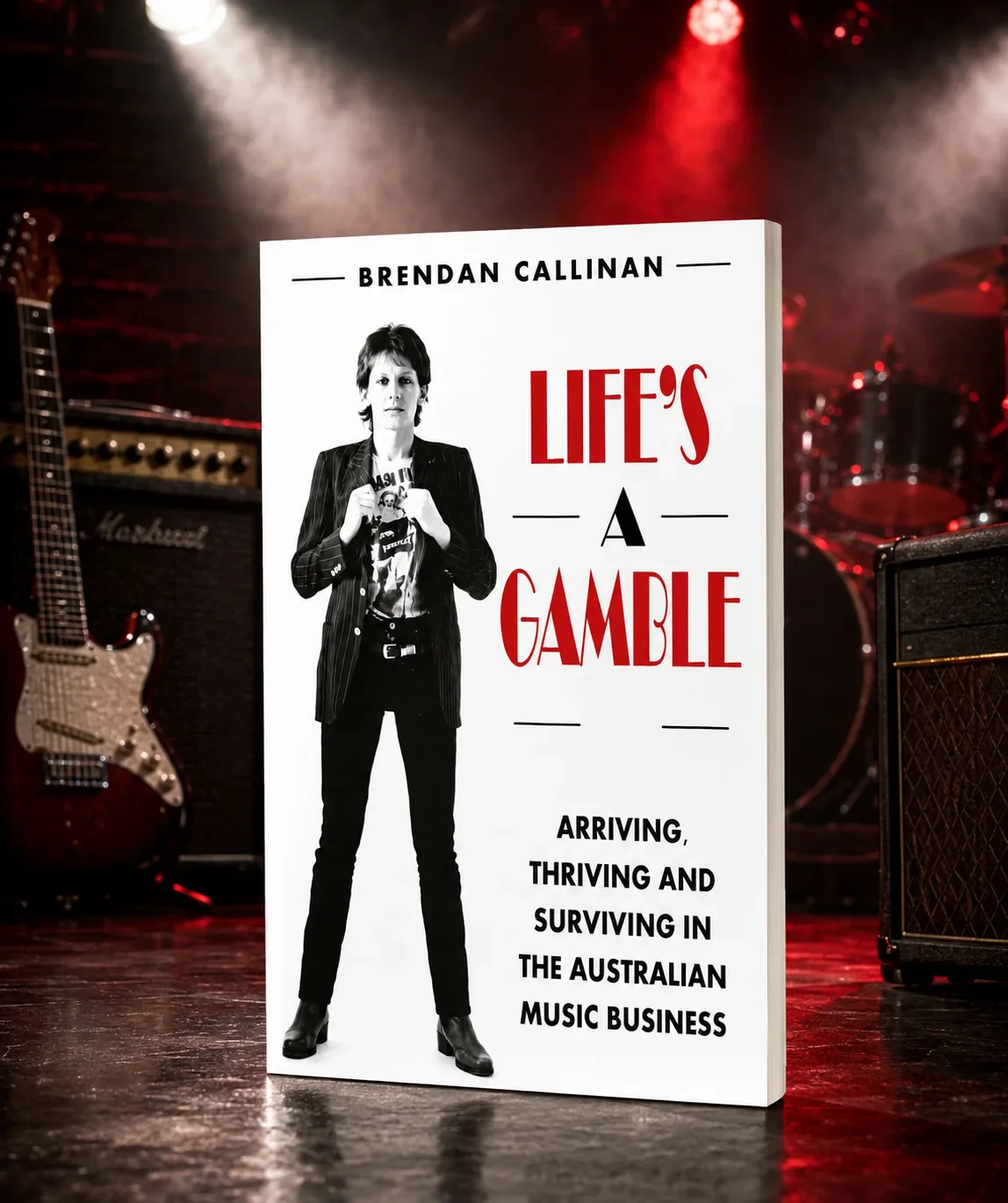 Life A gamble book cover featured with a stage background and guitar. Brendan Callinan former keyboardist of The Radiators is featured on the front book cover.