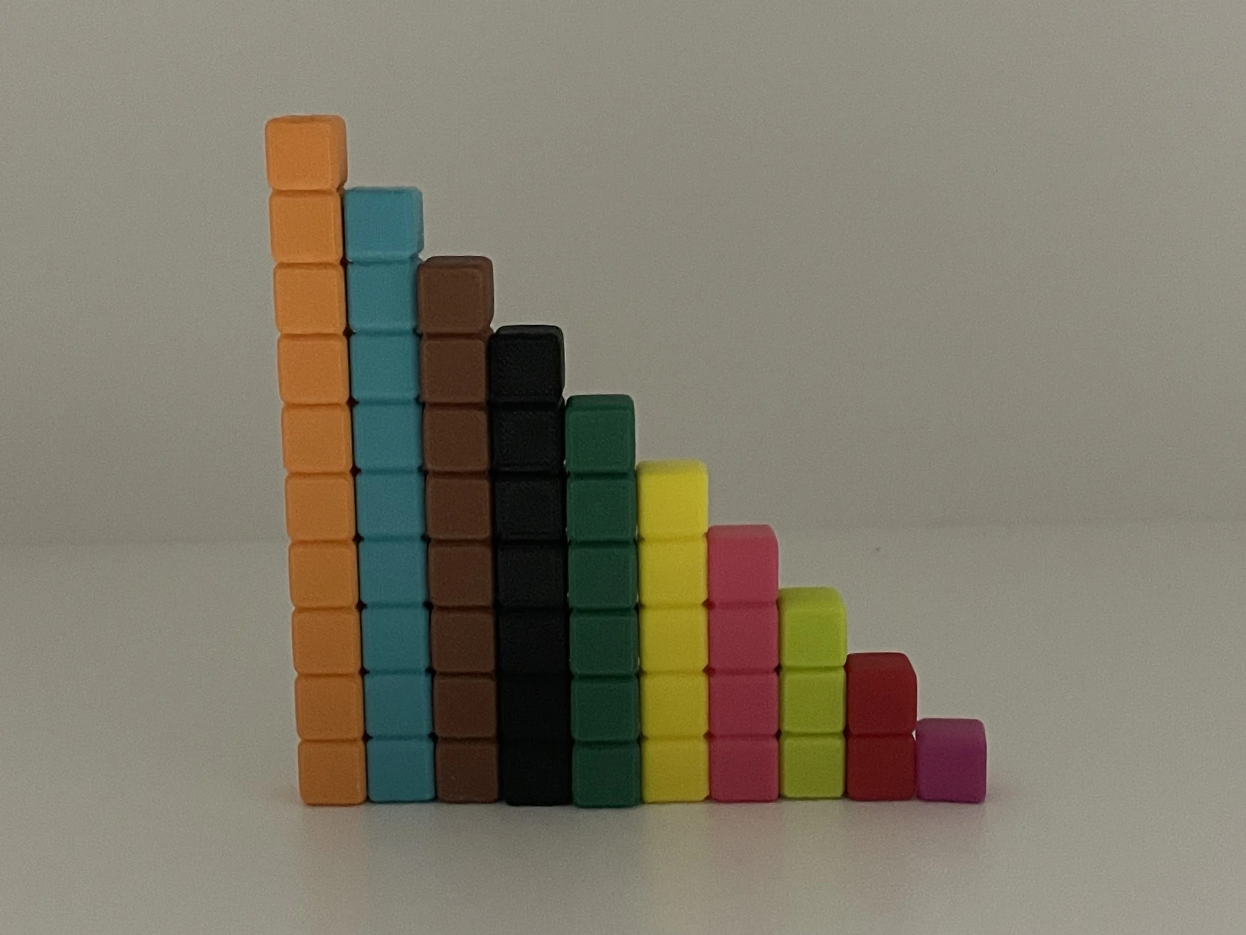 Colorful blocks arranged in a staircase pattern on a plain white background.
