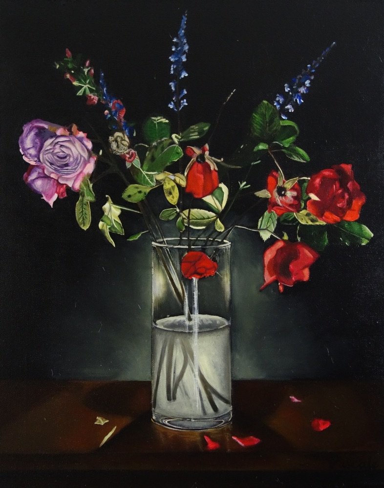 A painting of a glass vase with a bouquet of colorful flowers, including red and pink roses against a dark background on a wooden surface.