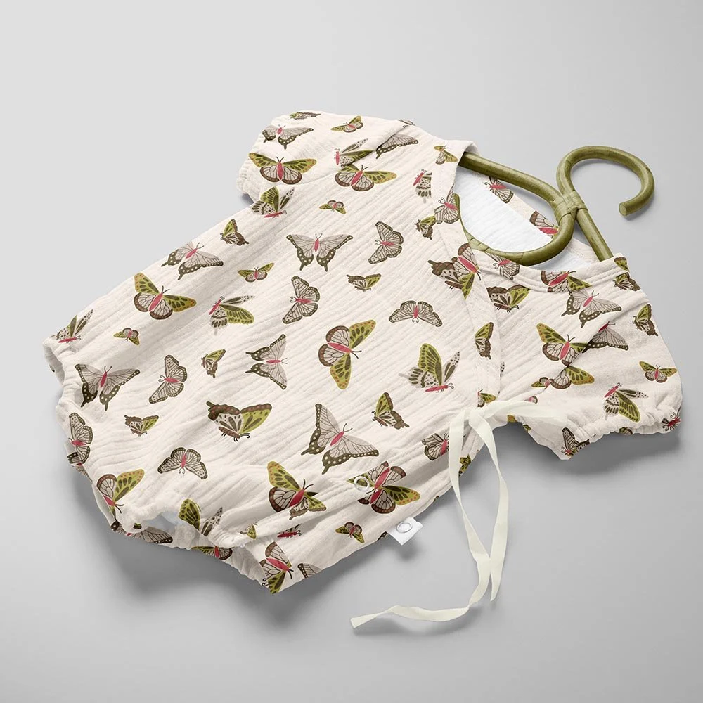Baby bodysuit with butterfly pattern