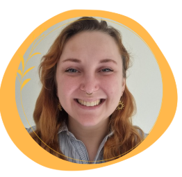 A photograph of Hannah Todd, founder of Sunflower Neurodiversity Hub. She has red hair and a bright smile.
