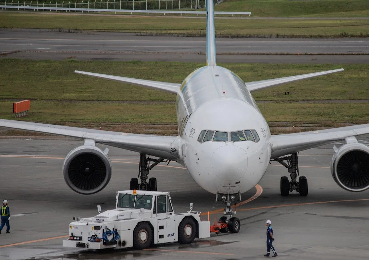JAL 767 being pushed back for departure at Sapporo CTS Airport, Japan