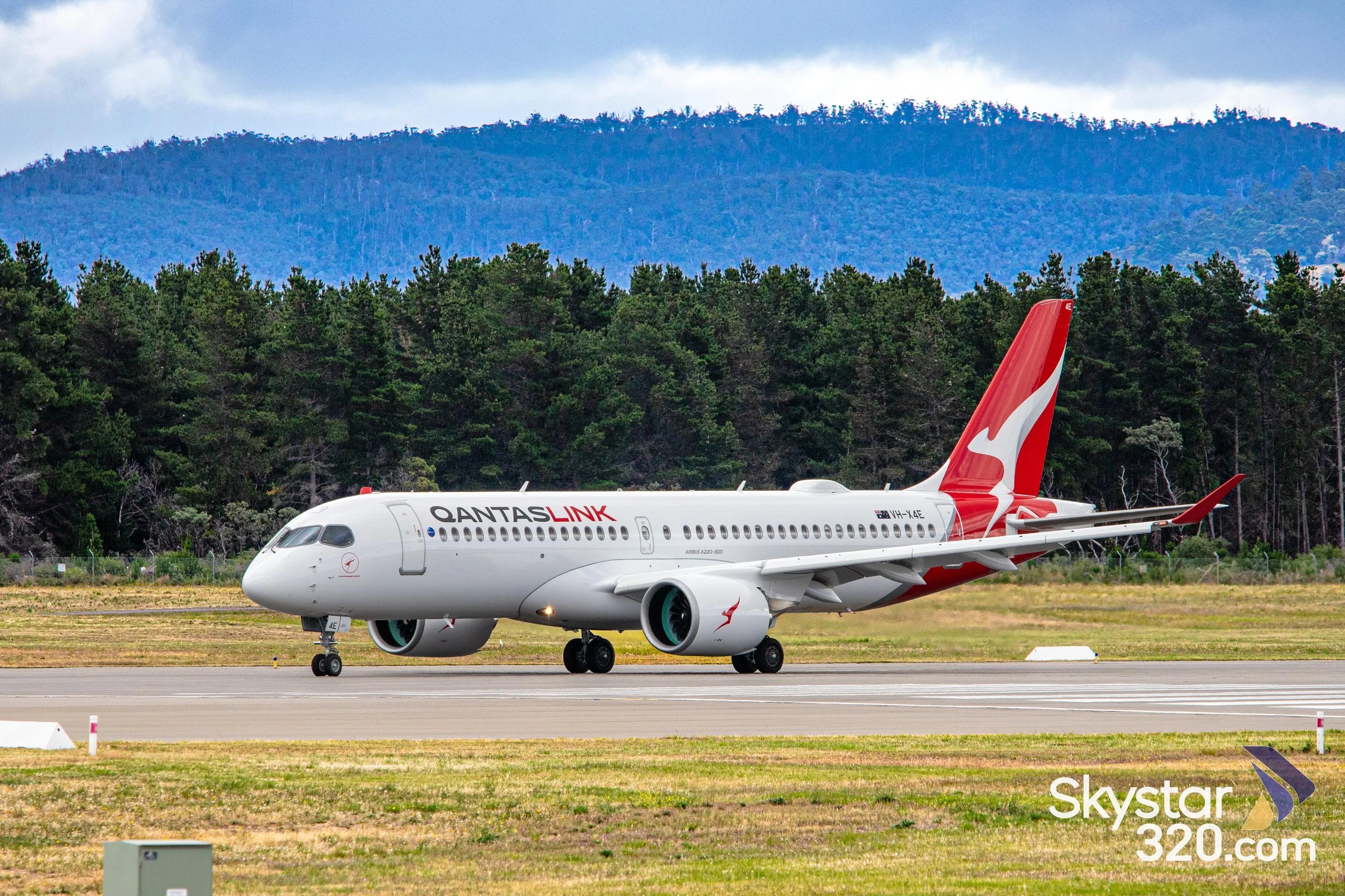QantasLink A220 departing Hobart Airport