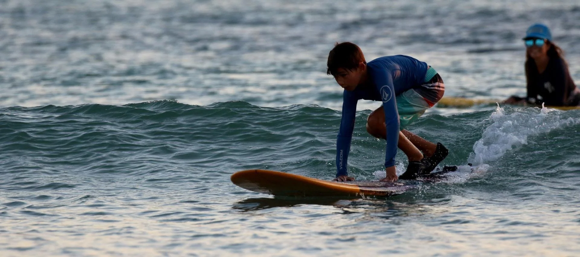Surfer riding a small wave at Squillers, Nembrala, Rote Island, Indonesia