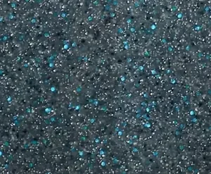 Close-up of a speckled, glittery surface with dark background and blue and silver sparkles.