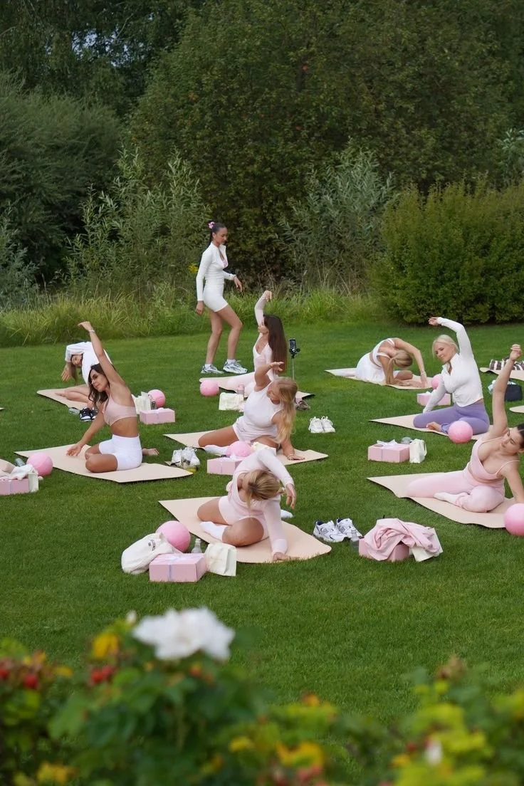 women doing workouts on a lawn