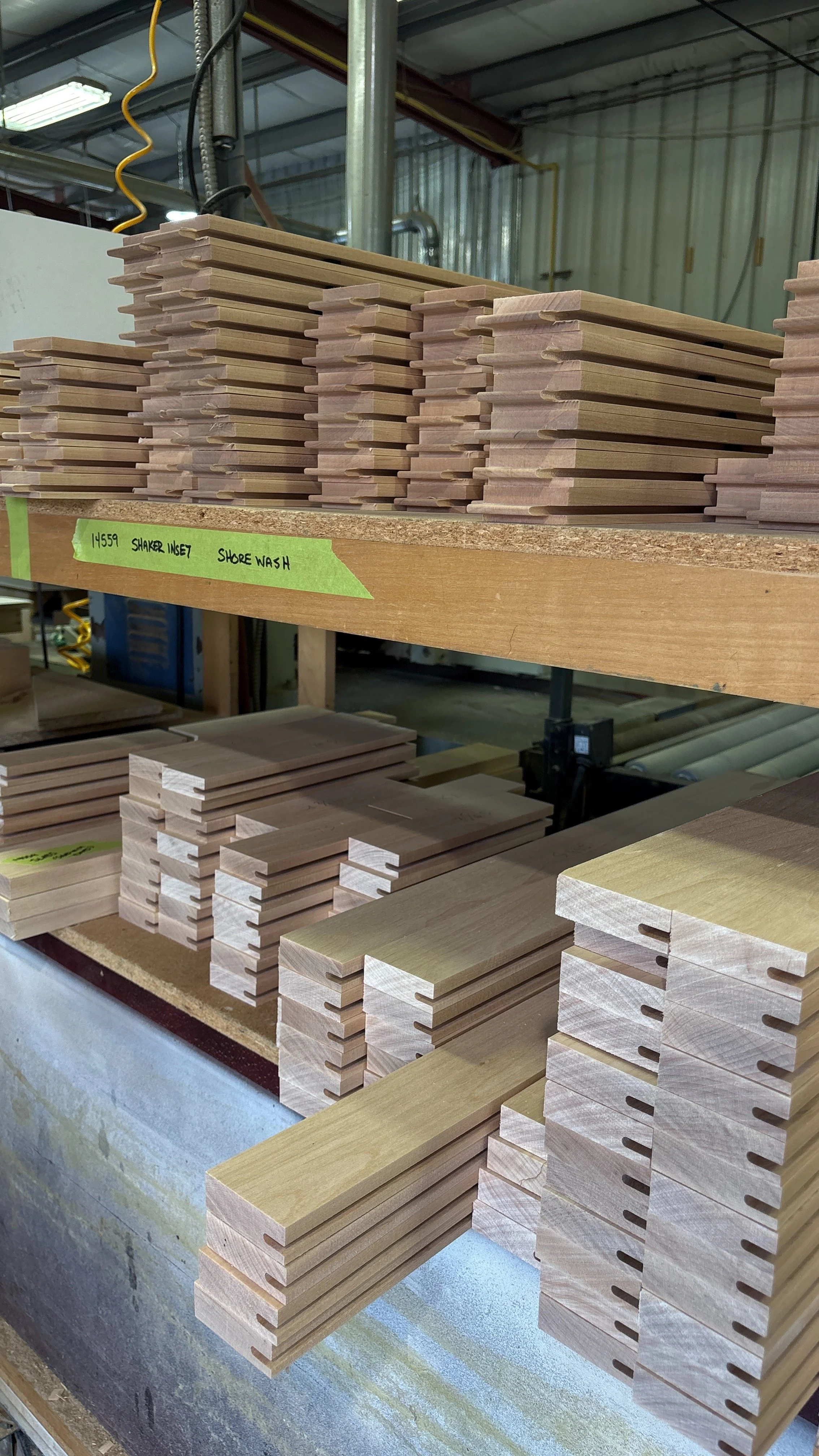 pre prepped stacks of door stiles and rails used to make custom wood doors