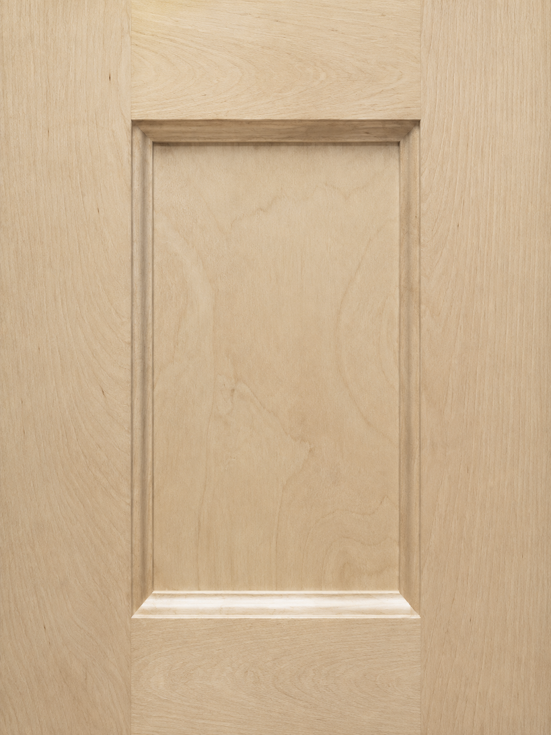 Close-up of a light wood cabinet door with a raised panel design.