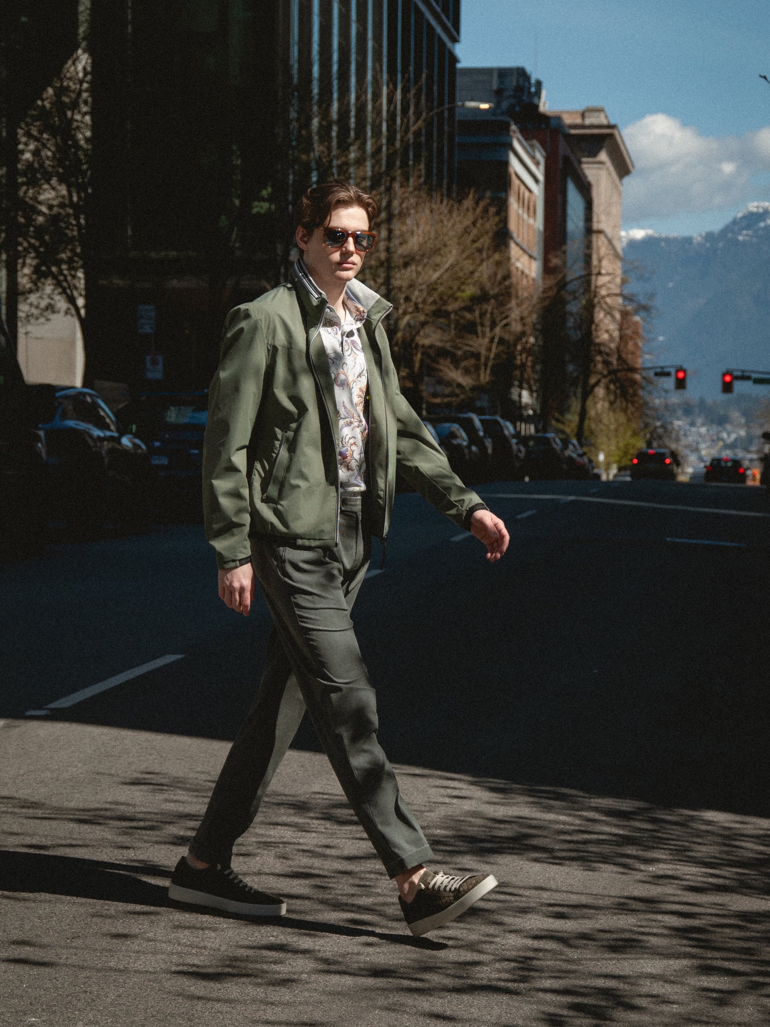 The transitional jacket.⁠
⁠
A technical bomber in olive, cut for Vancouver and the weather it comes with. Worn over a floral cotton polo and washed wool trouser.⁠
⁠
The Look⁠
Technical Waterproof Bomber - @milestone.jackets⁠
Floral Cotton Polo - @etr