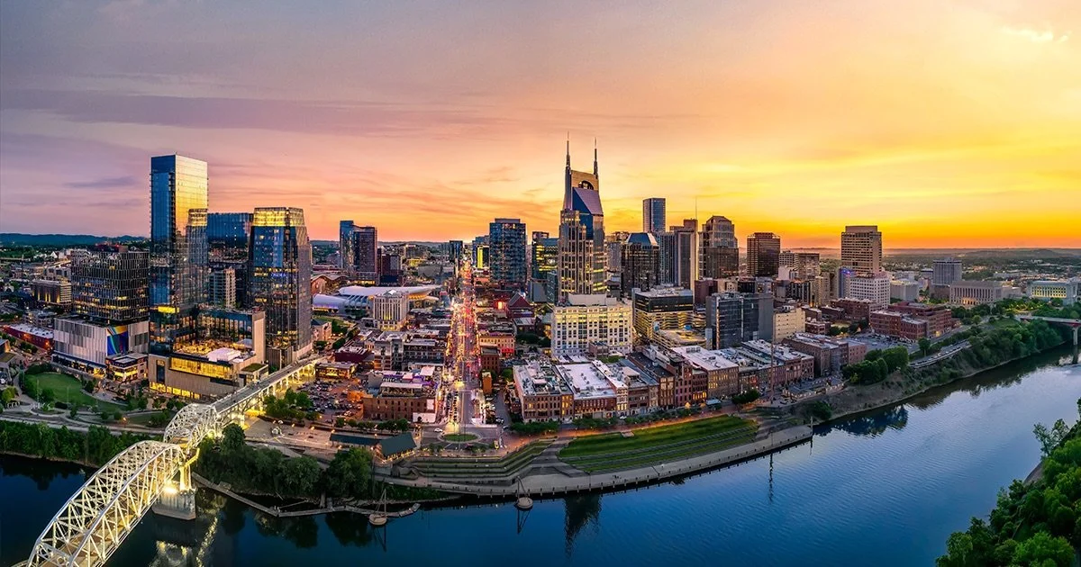 Downtown Nashville, Tennessee skyline at sunset with the Cumberland River, served by Mr. H Remodel