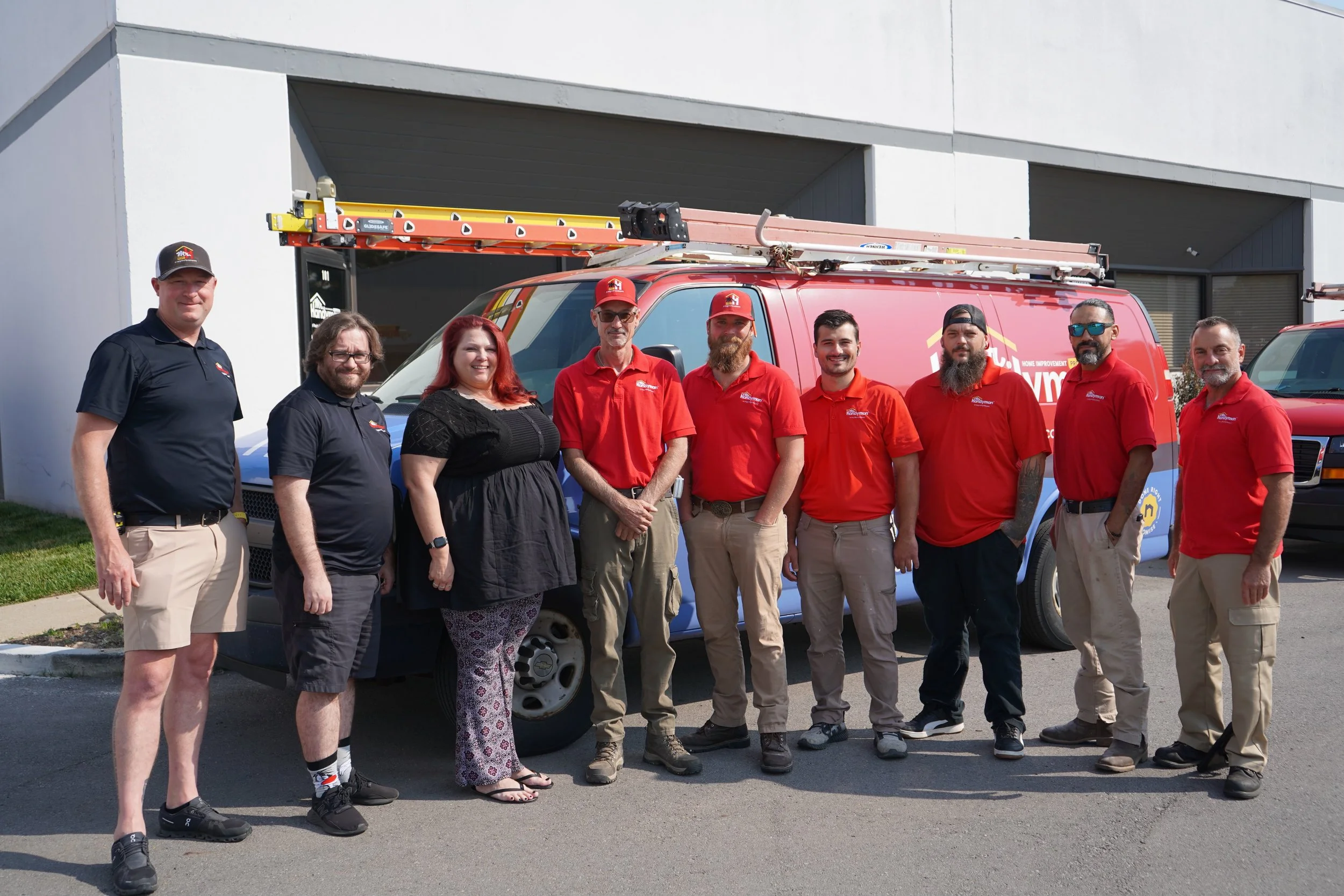 Mr. Handyman team standing in front of a branded service van at their Nashville office