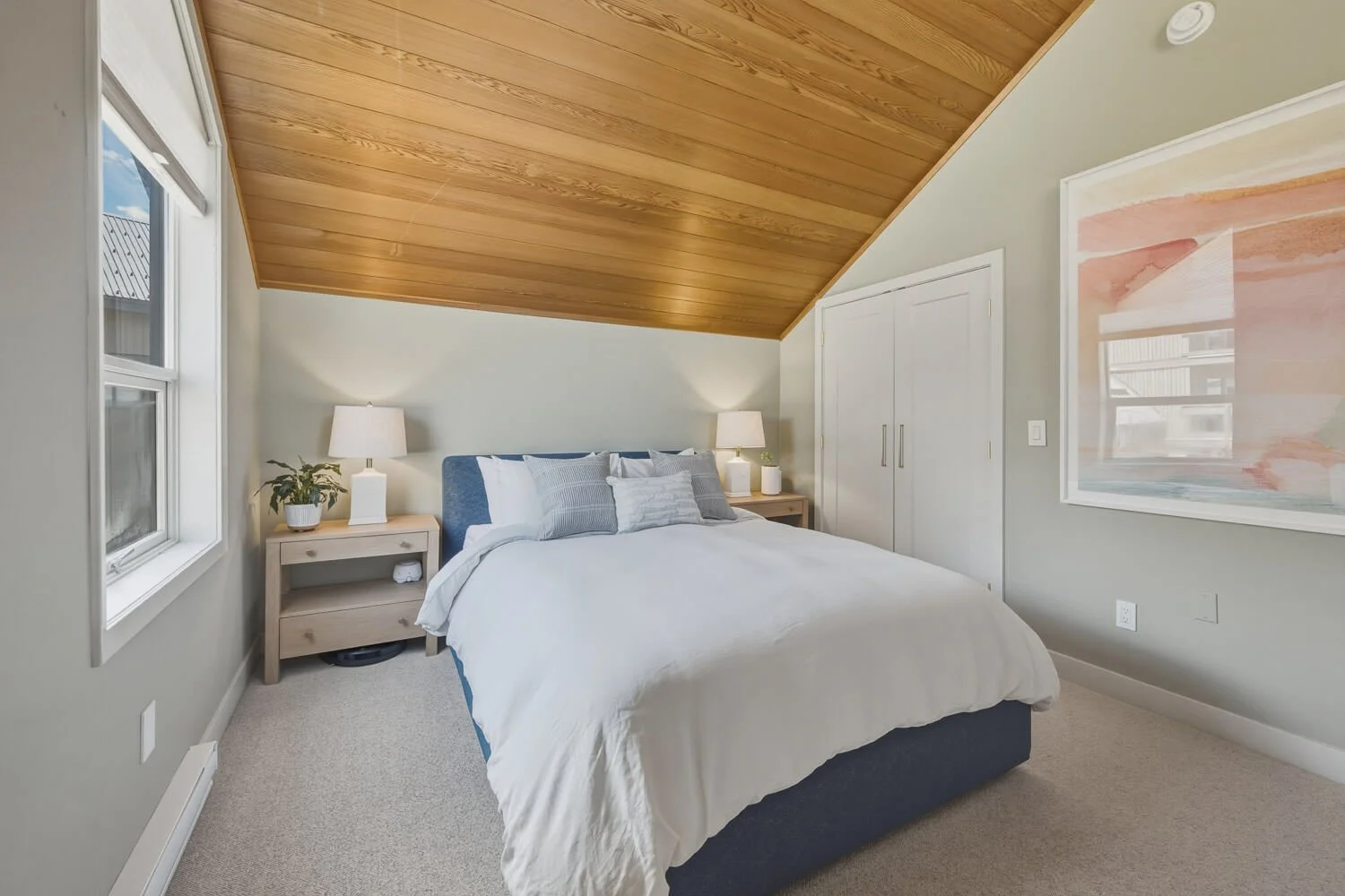 The master bedroom with vaulted cedar ceiling (and new windows to be installed this summer)