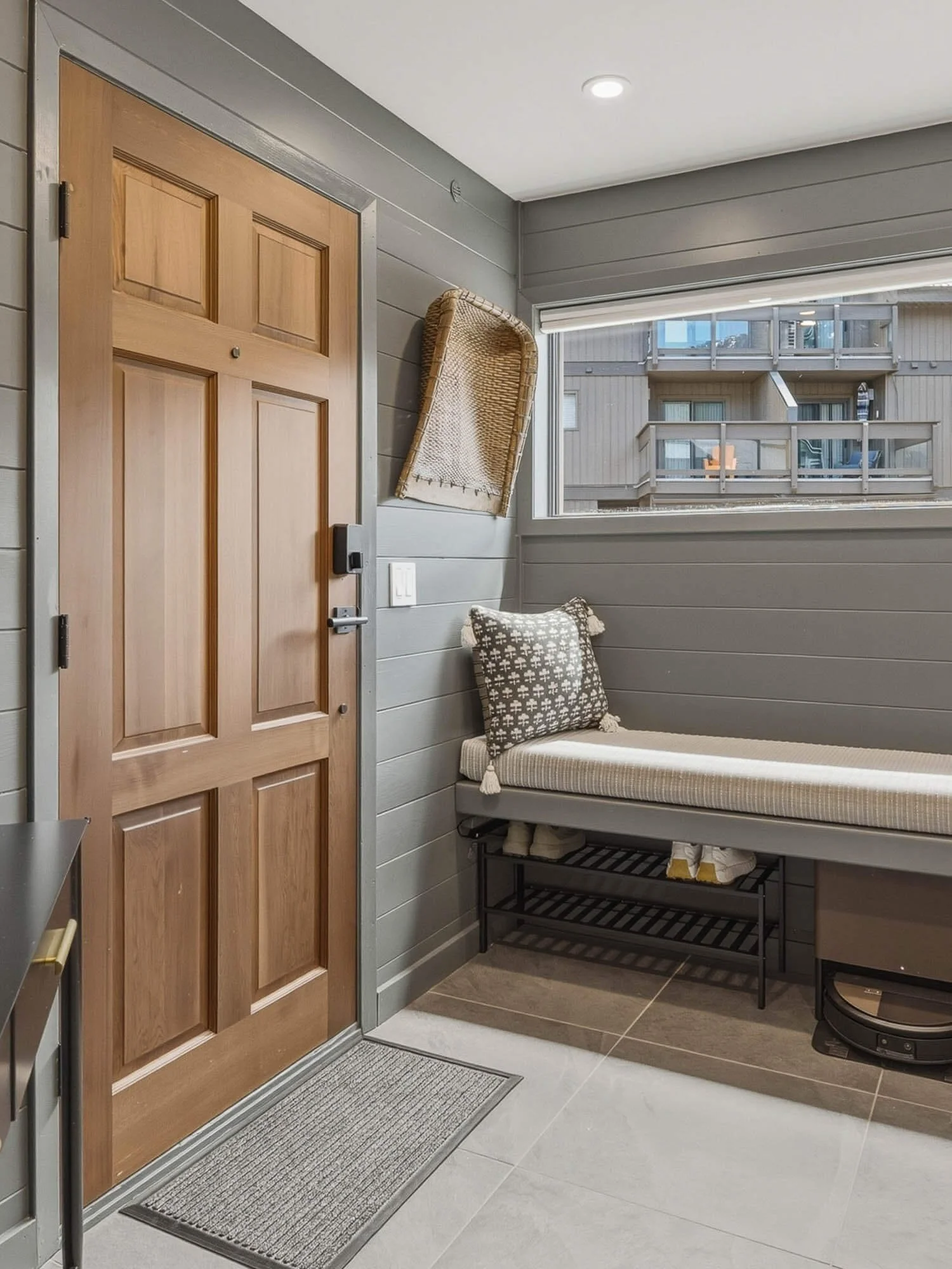 Bright interior utility space at 6117 Eagle Drive showing a custom storage bench nook.