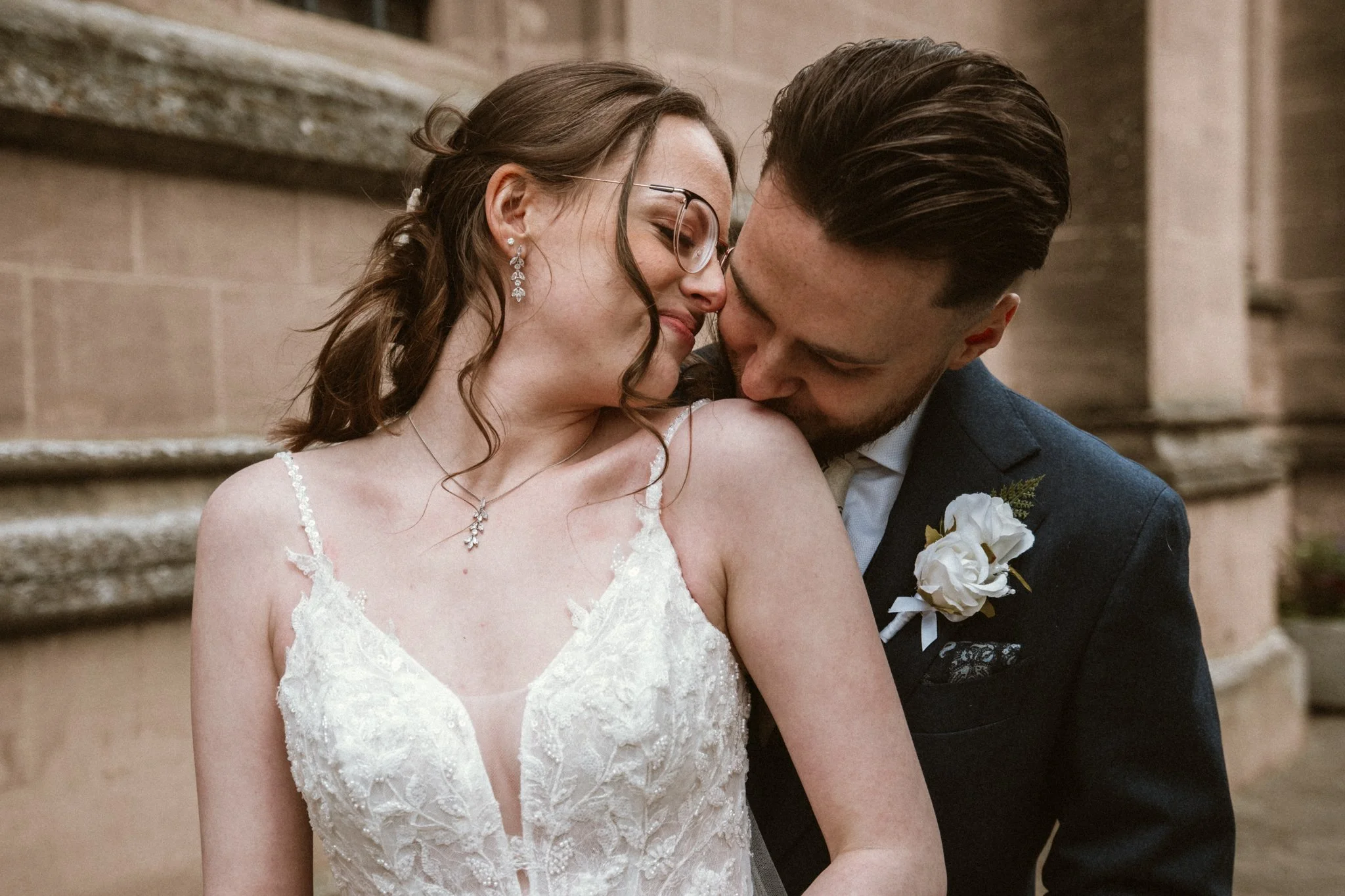 A bride and groom share a close moment on their wedding day, in Bury St Edmunds, Suffolk.