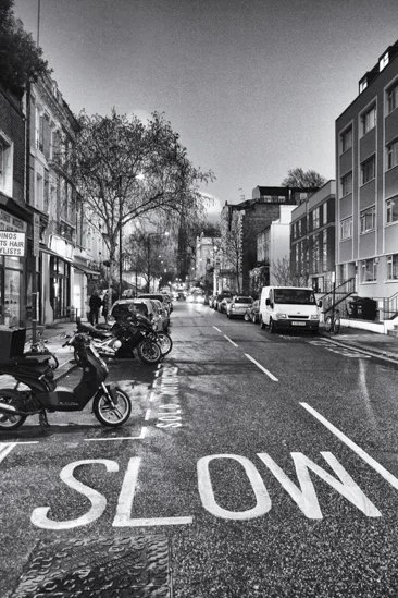 Infrared- "Slow, Notting Hill, London  U.K." Road. Night. Motorcycle. Cars. Tree.