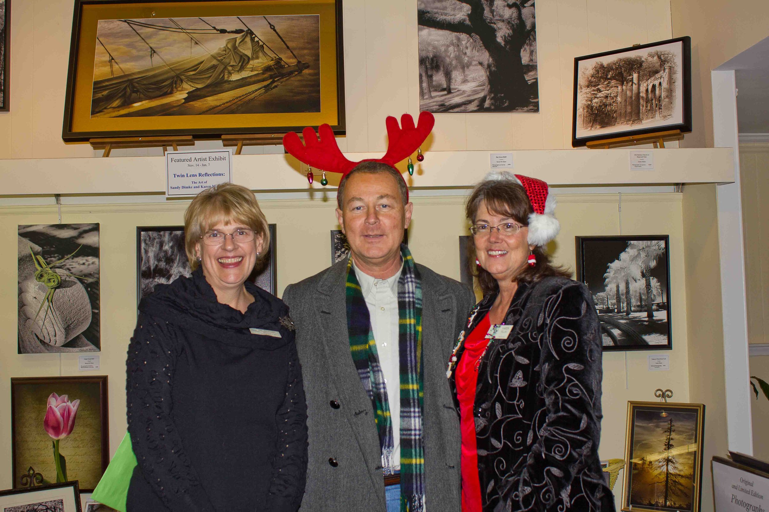 Karen M. Peluso (R) with Sandy Dimke and Beaufort Mayor Pro Tem Mike McFee at Dimke and Peluso's "Twin Lens Reflections" Joint Exhibit. Beaufort Art Association Gallery. 2011