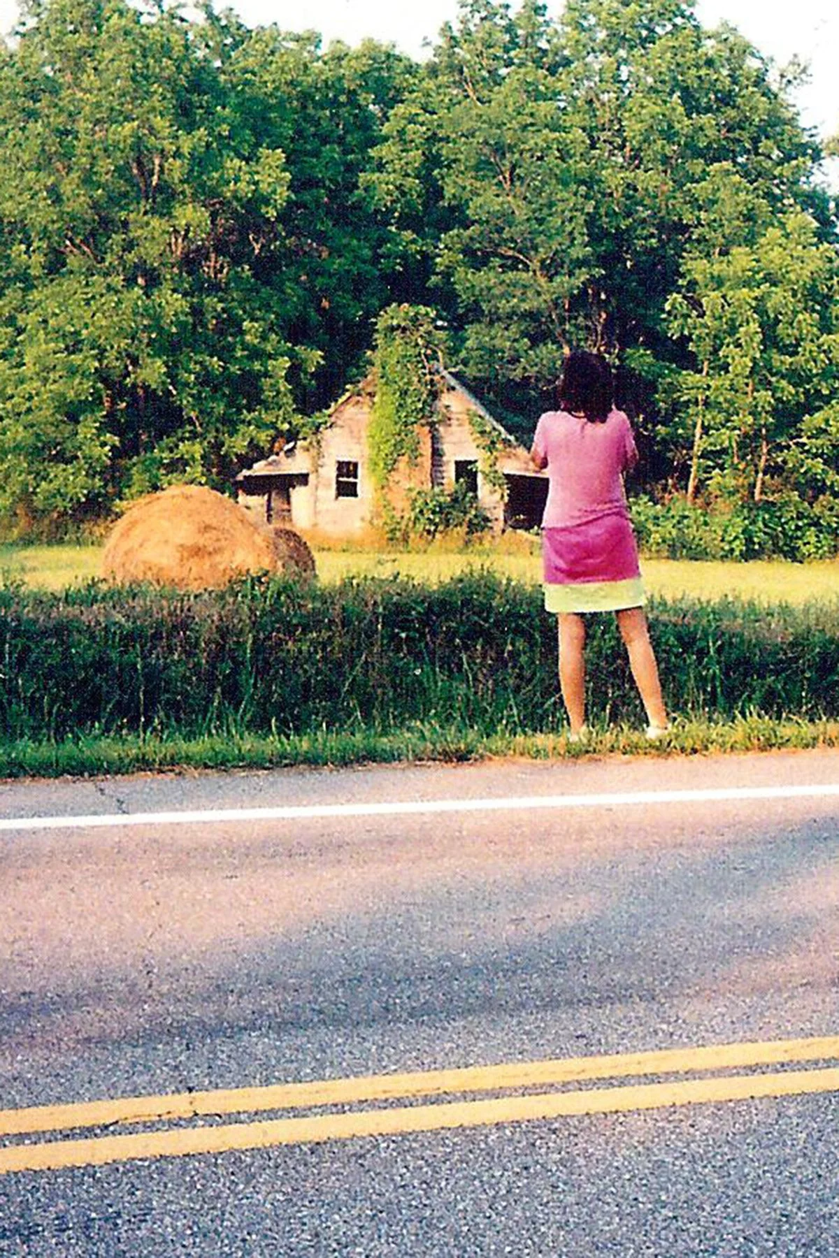 Karen M. Peluso Photographing Field of Hay Bales and Shack. Blairsville GA 2011
Photo by Clinton B. Campbell