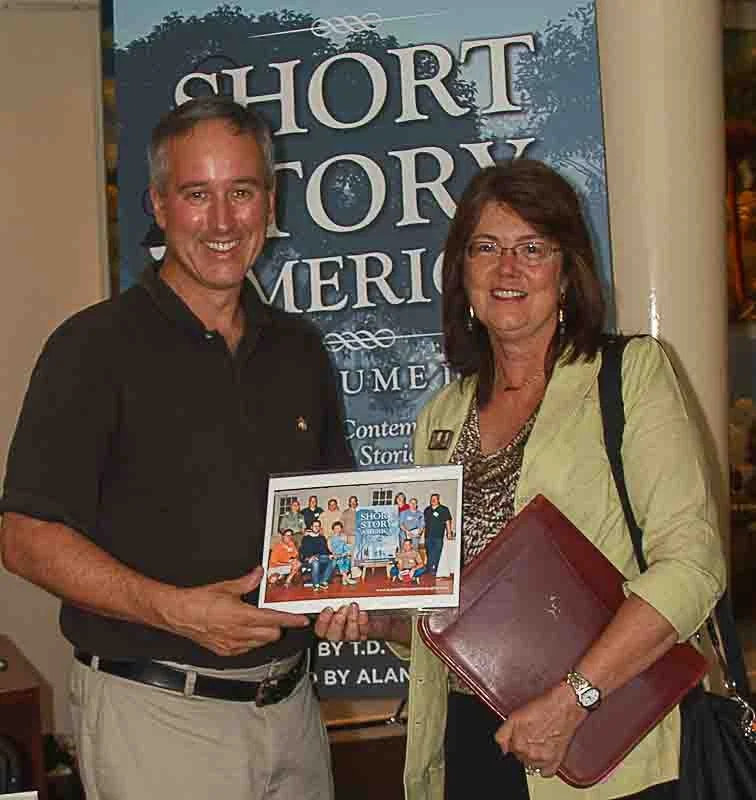 Author T.D. Johnston with Karen M. Peluso with her photo of inaugural Short Story America Authors (Photo by Rebecca Bass)