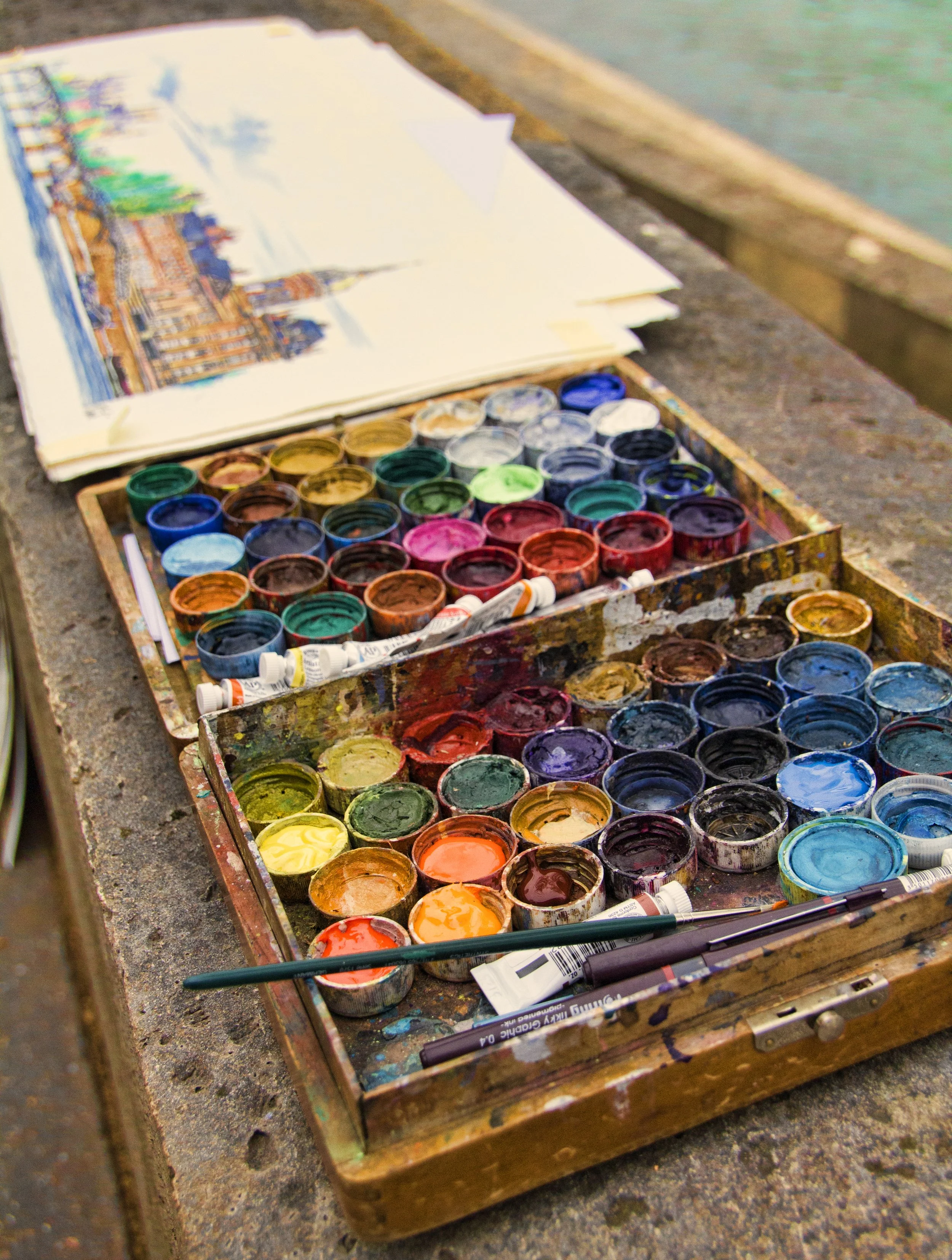 Simply Color- Artist's Paints Along the Seine, Paris, France. Pots. Brushes. Paper.