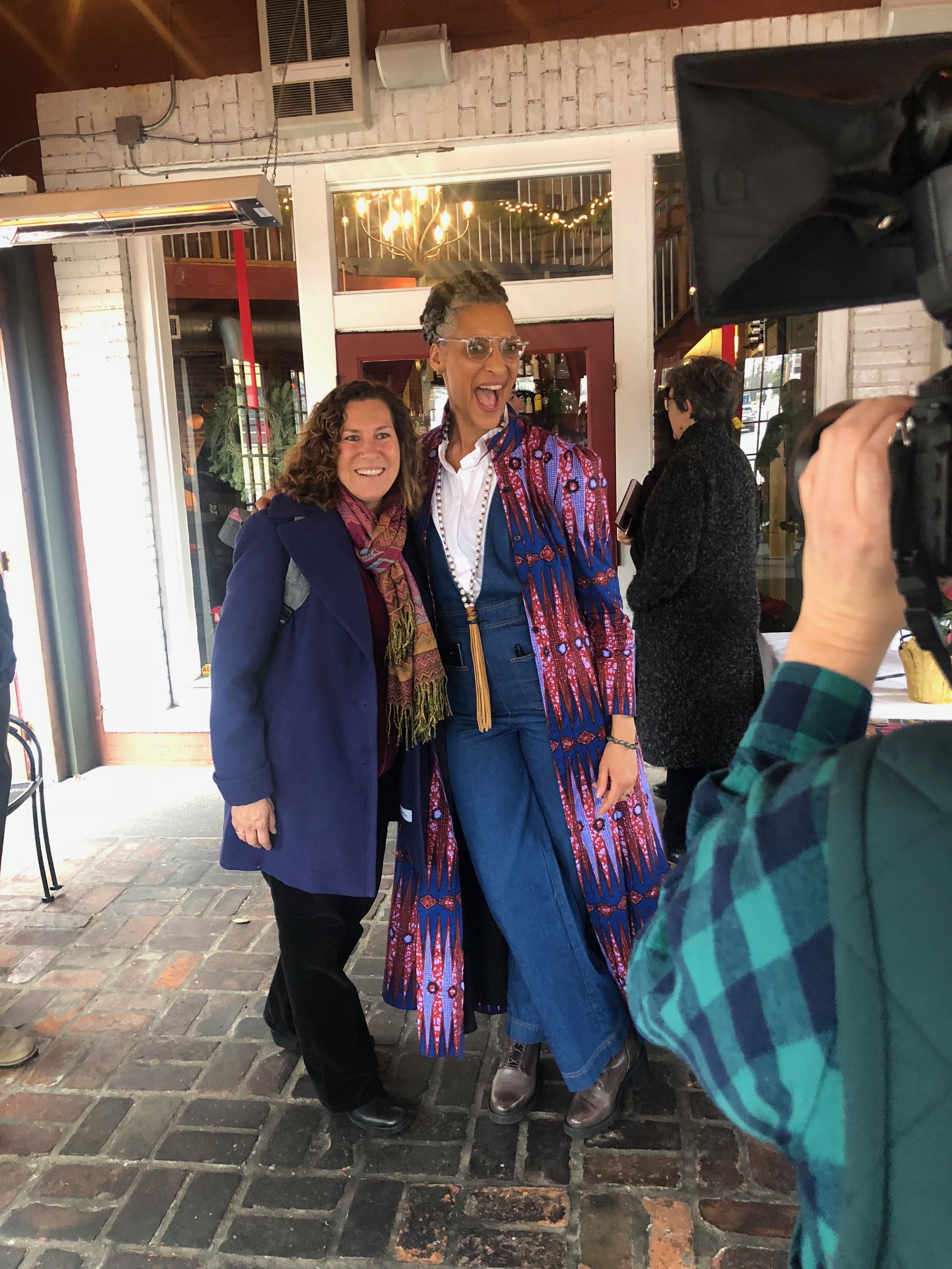  Chef Carla Hall and a fan being photographed at a Les Dames Nashville lunch event at Cafe Margot in Nashville, TN 