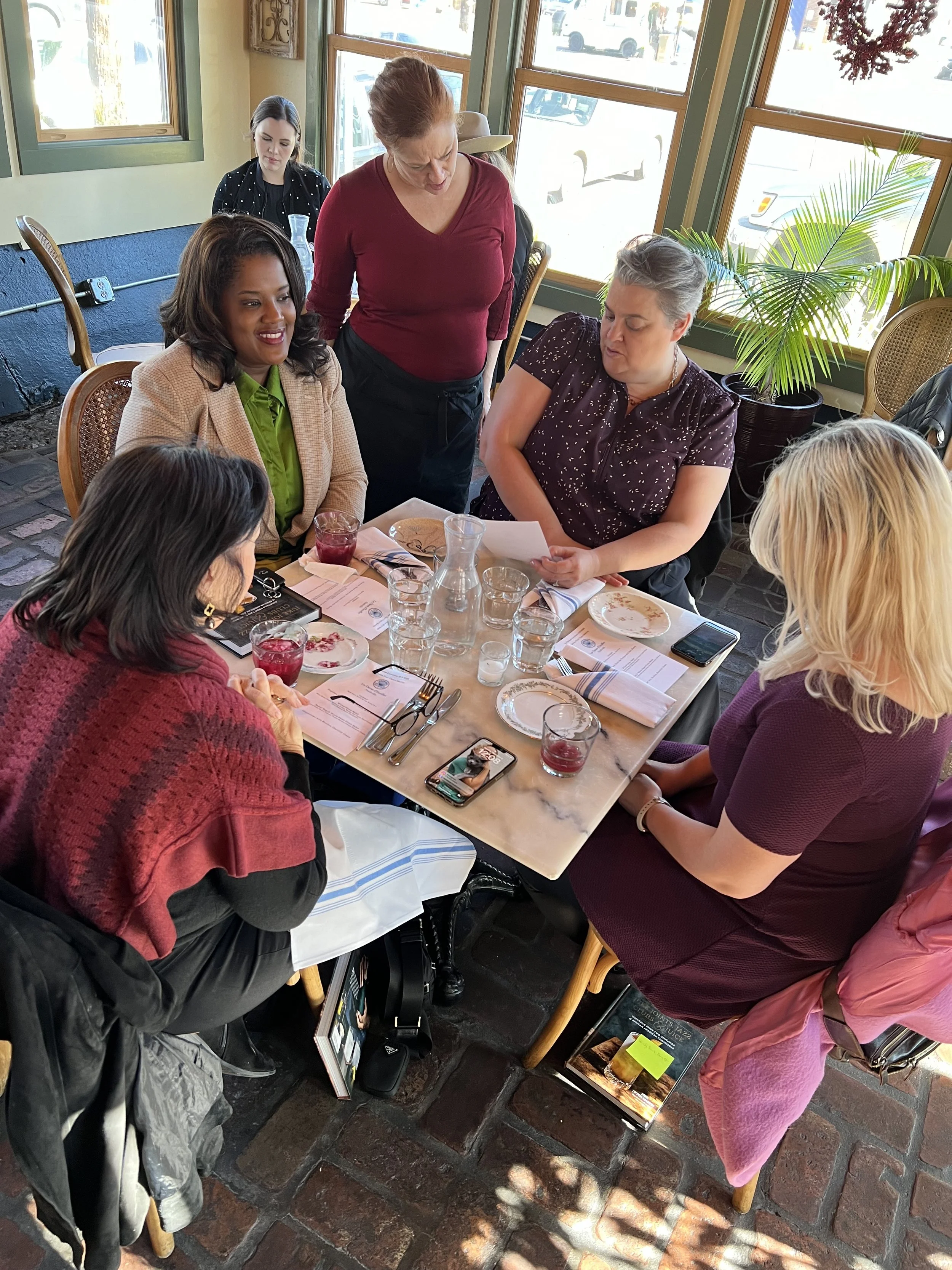  A group of women enjoying lunch at a Les Dames Nashville lunch event at Cafe Margot in Nashville, TN 