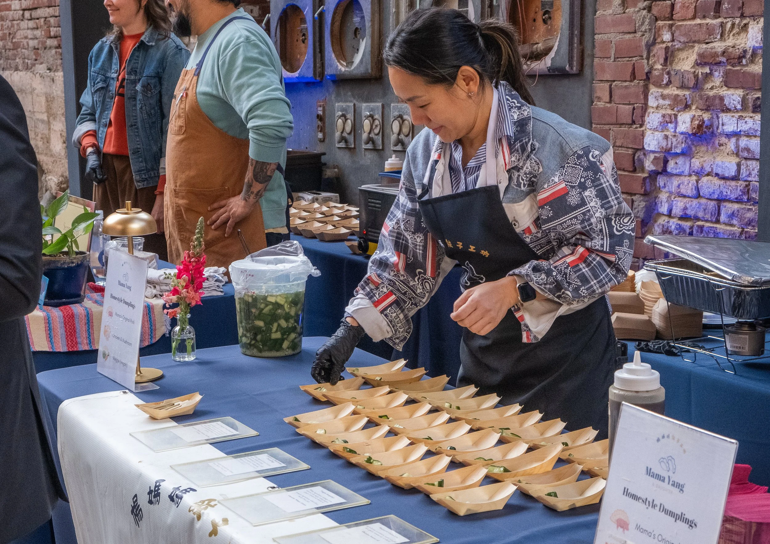  Chef Grace Tseng of Mama Yang and Daughter serving dumplings at “La Fete De Dames” a fundraiser event organized by Les Dames Nashville 