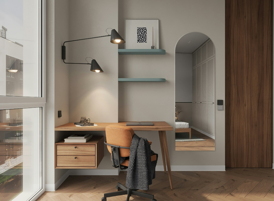 Home office with wooden desk, orange chair, wall-mounted lamps, shelves, decorative framed art, mirror, and view into a bedroom.