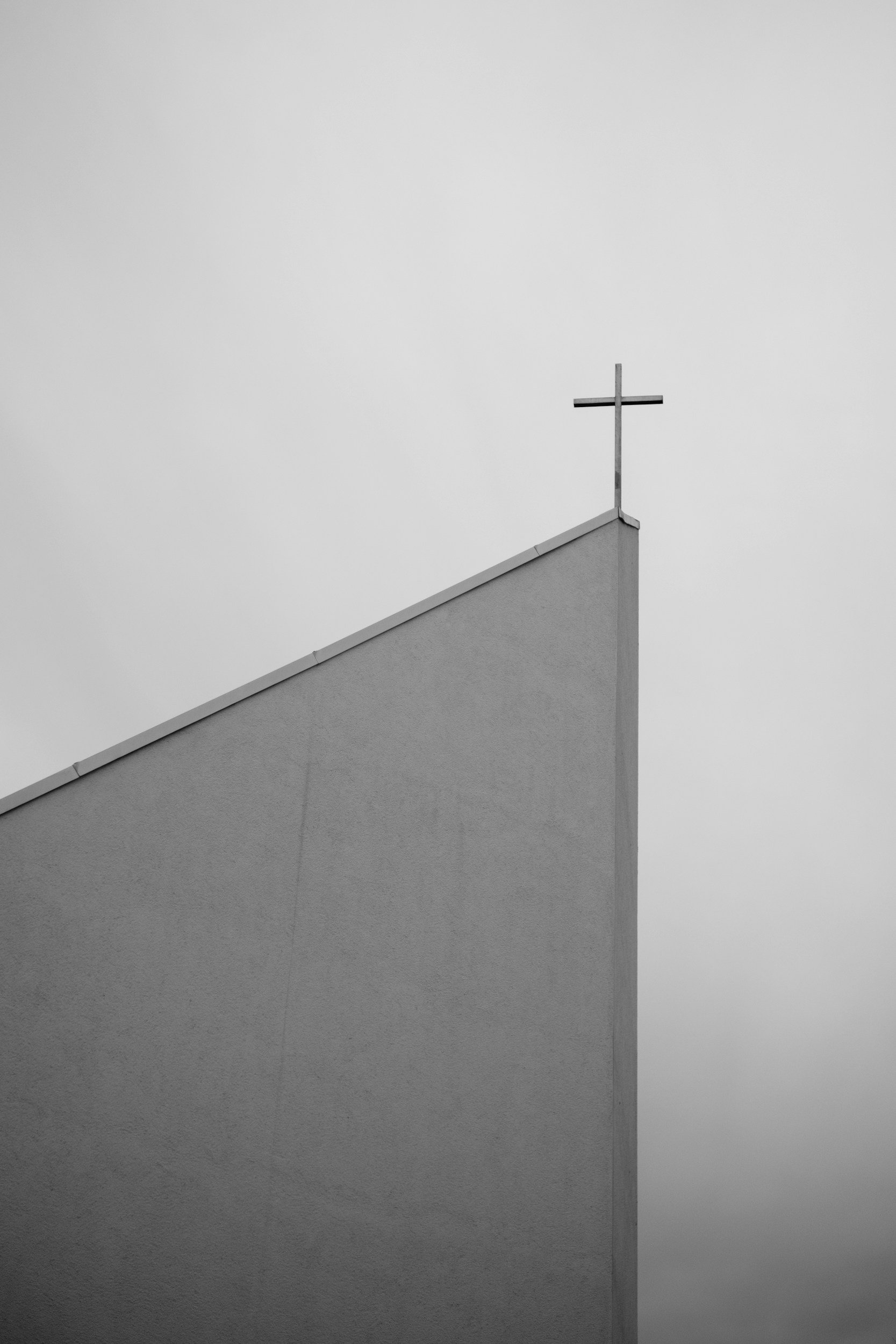roofline of a modern church building in black and white