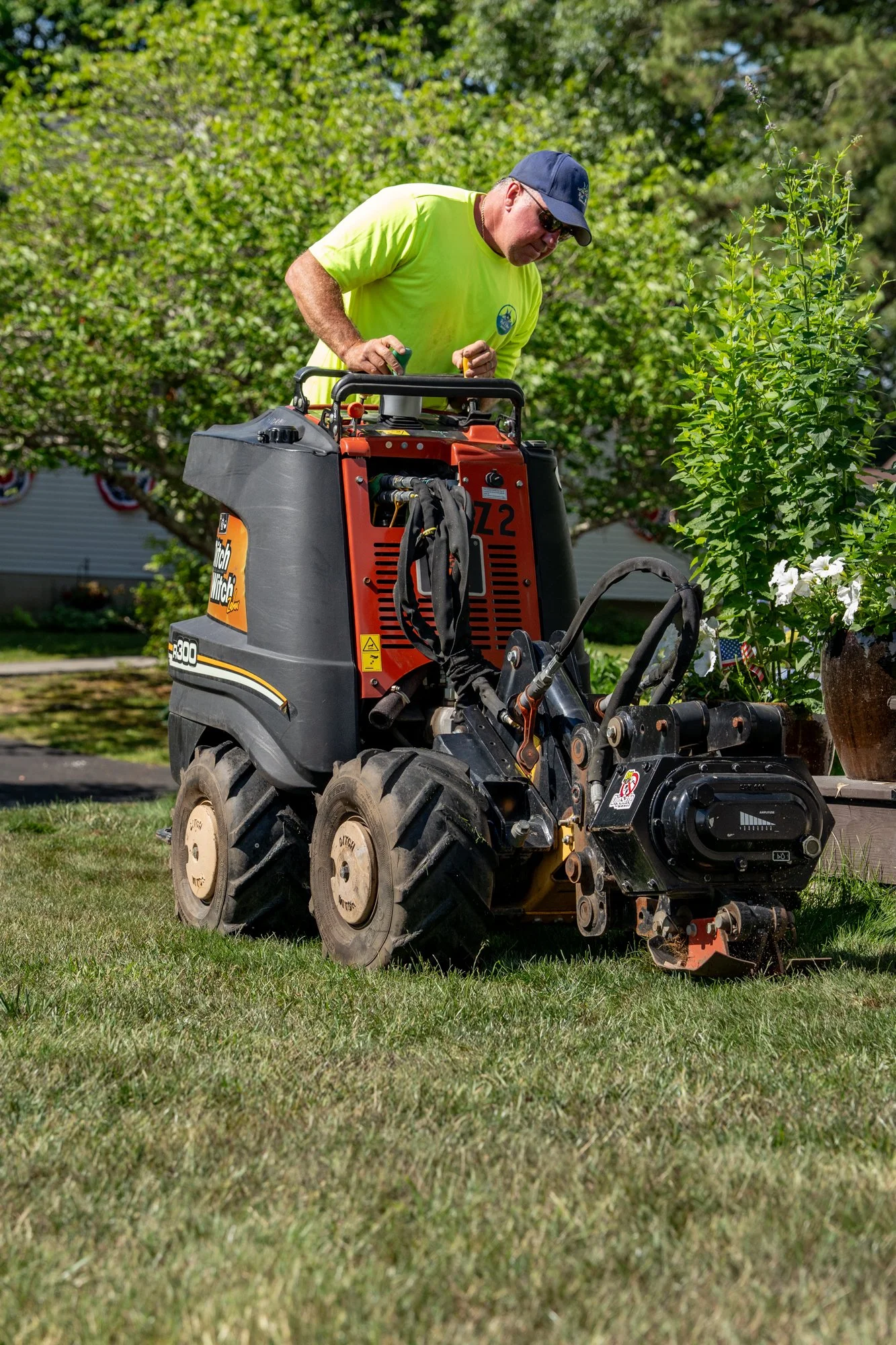 Robby pulling pipe for a new irrigation system on Cape Cod
