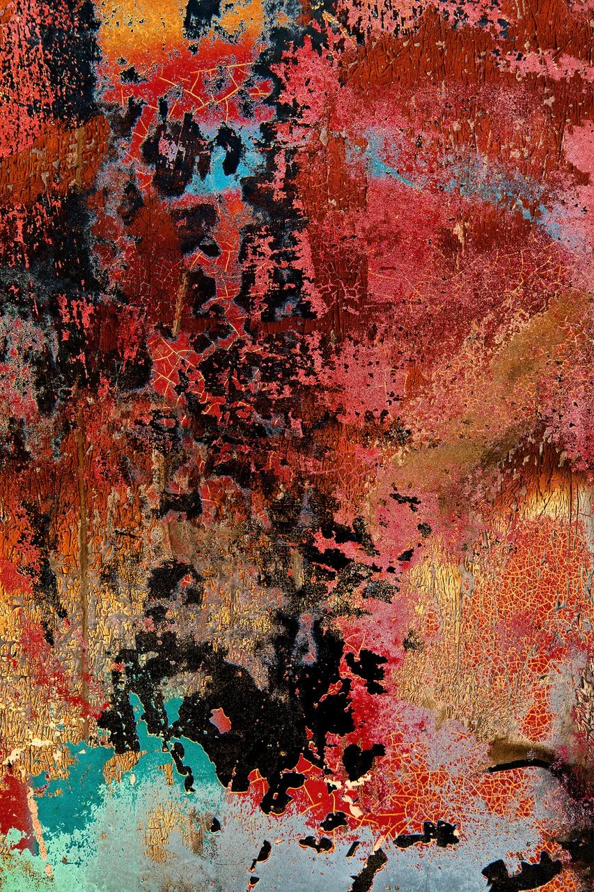 Abstract textured artwork with red, black, pink, and blue colors and crackled patterns.