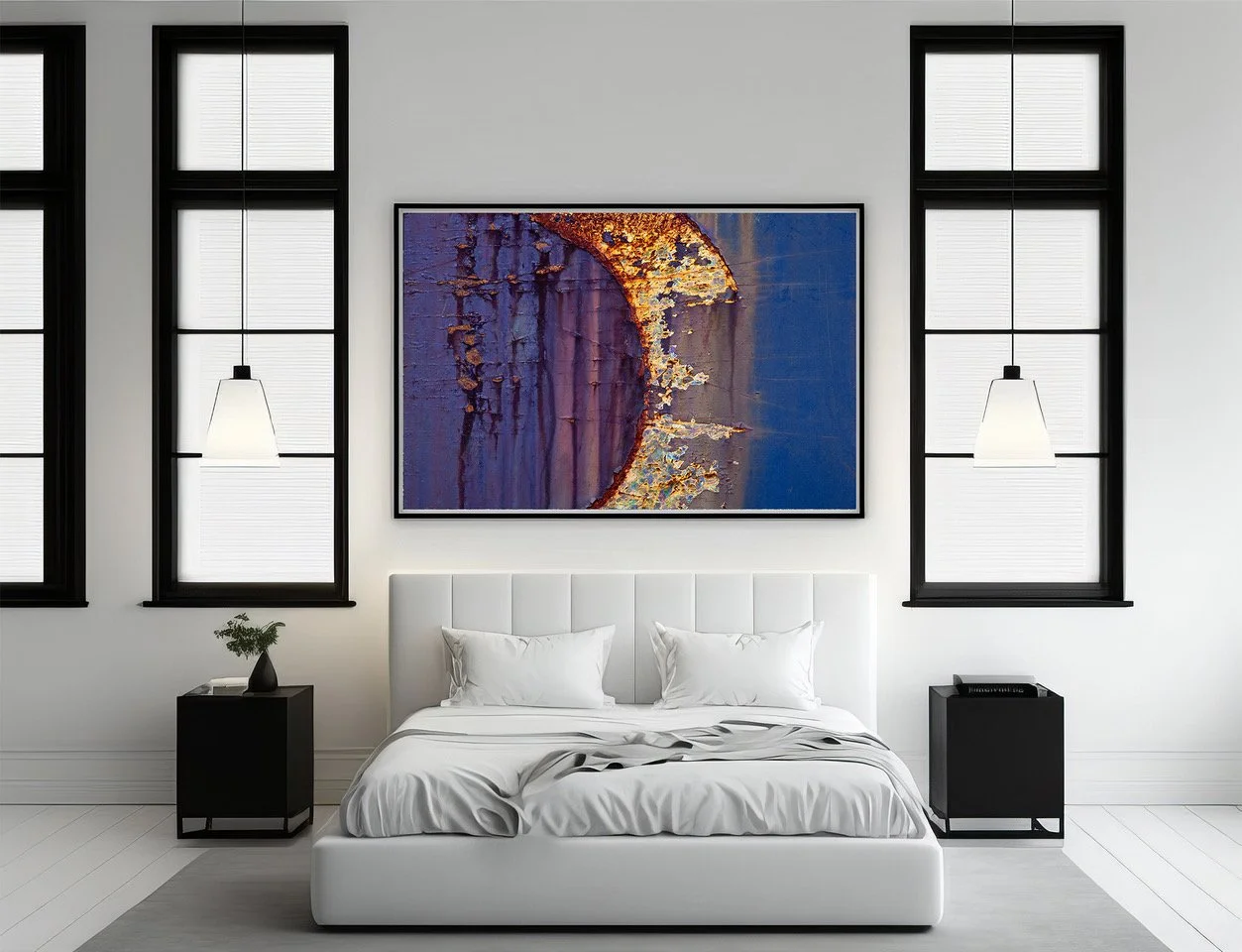 Modern bedroom with white bed, black nightstands, abstract painting above bed, and large windows with black frames and white blinds