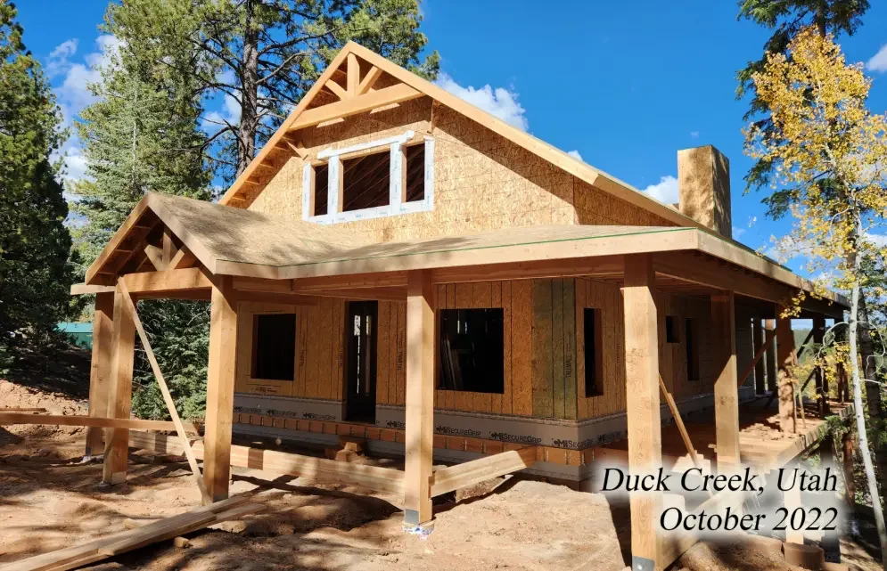 A house under construction with wooden framing, located in Duck Creek, Utah, in October 2022.