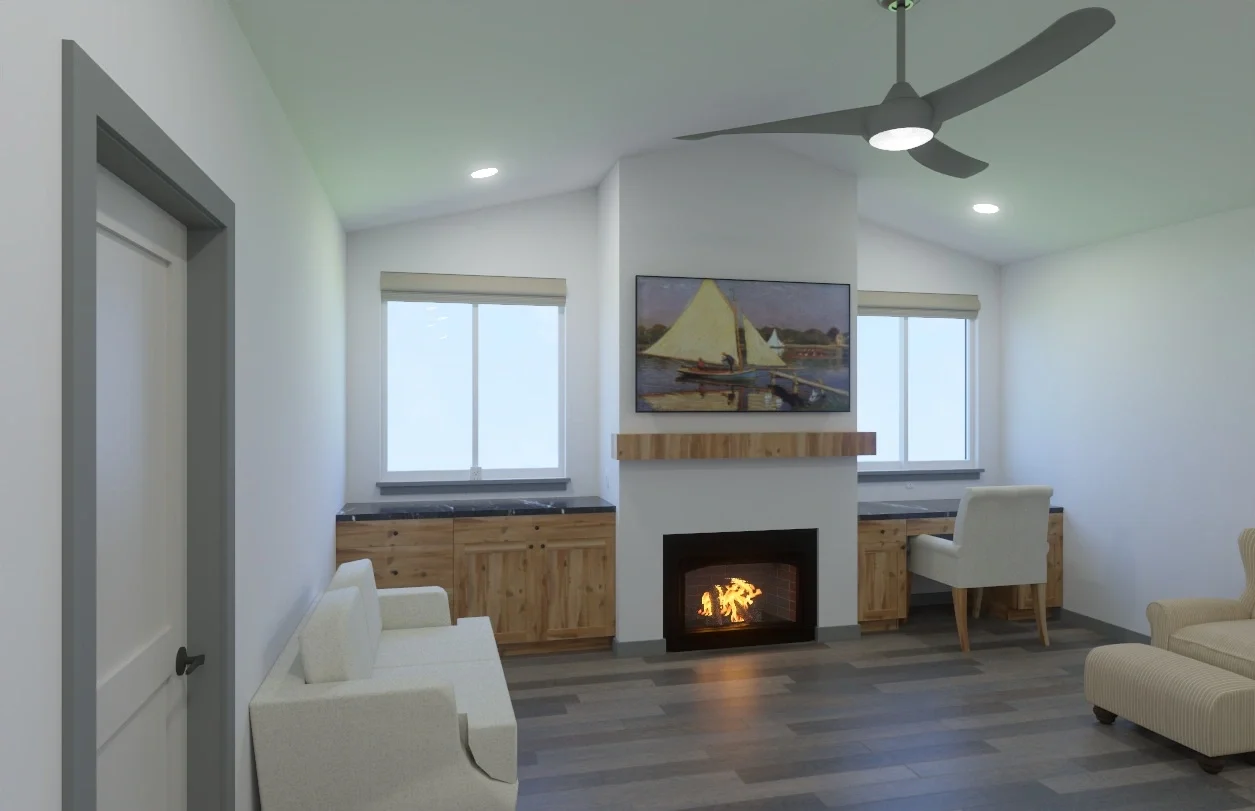 Living room with white walls, hardwood flooring, a fireplace, two large windows, a modern ceiling fan, a painting above the fireplace, and various furniture including a white armchair, a beige armchair, and a desk in the corner.