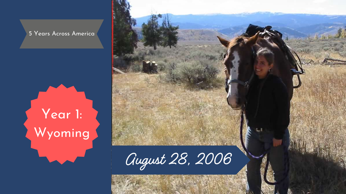 Woman hugs the head of a horse whle they both face the camera