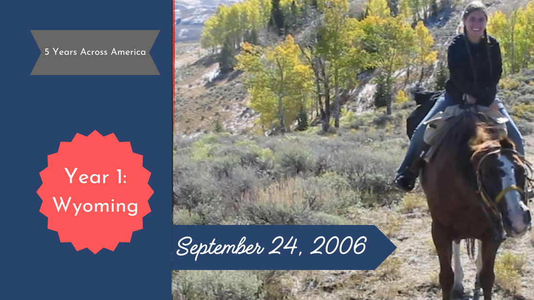 Woman rides a horse on a mountain with light snow and yellow aspen trees