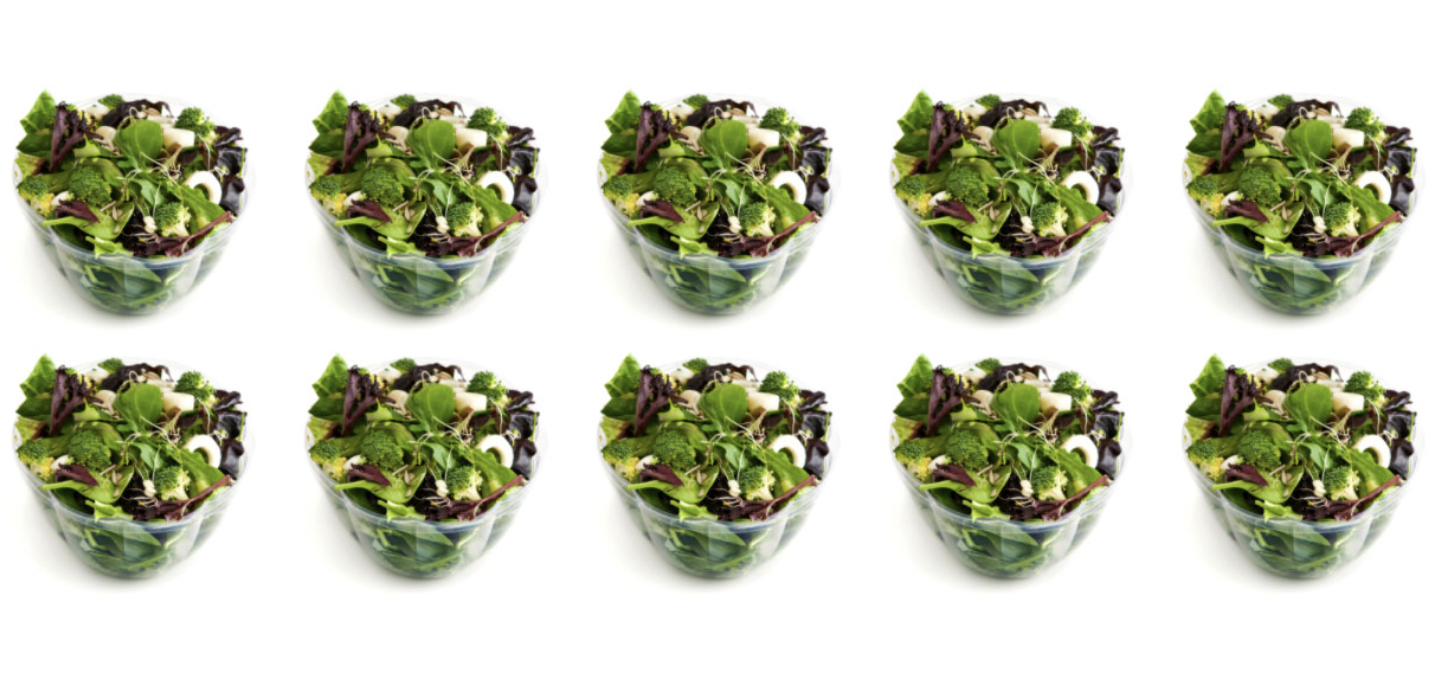 Fresh green salad leaves in a bag, representing Verde's commitment to healthy dining in Charleston, SC.
