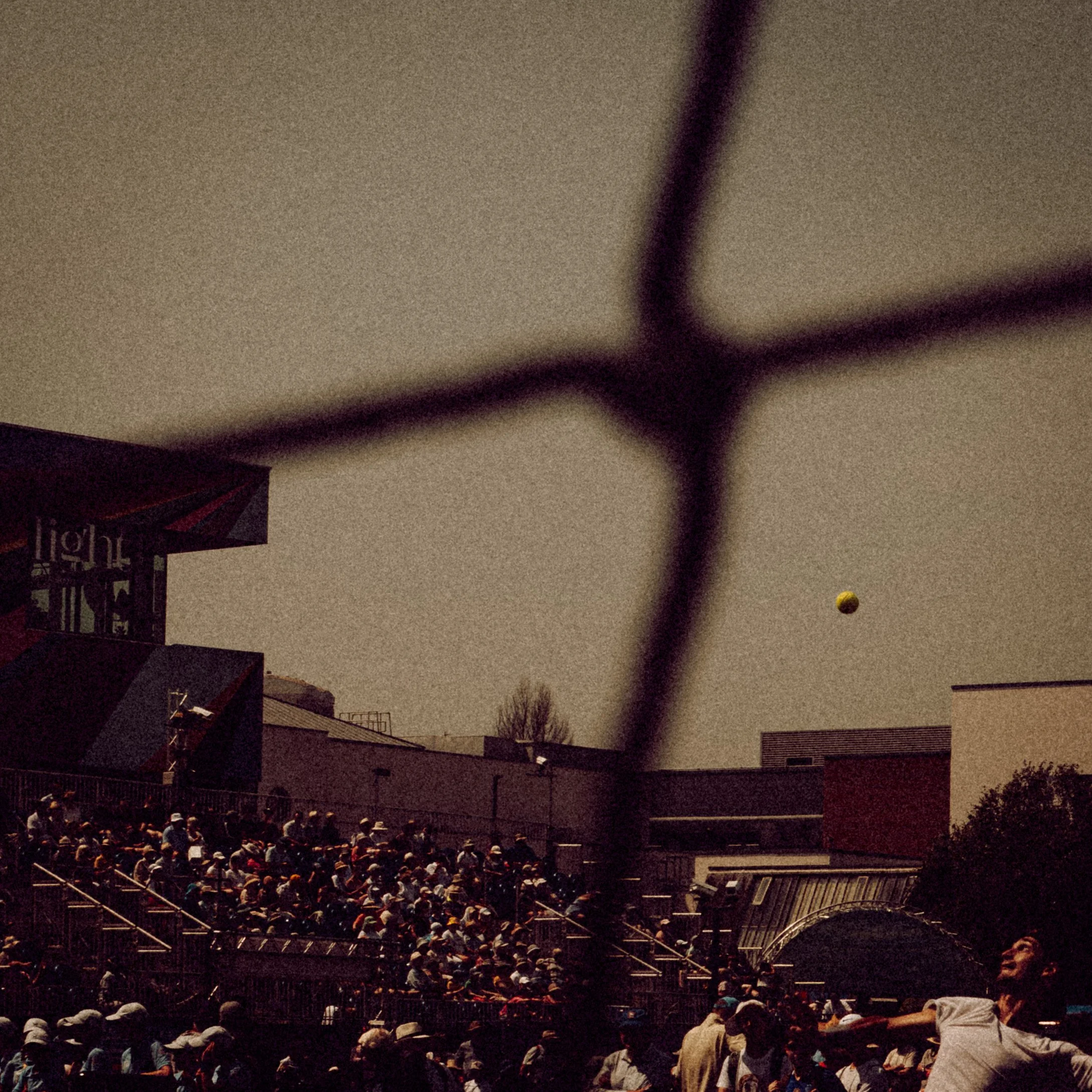 A male tennis player serving at ATP Eastbourne