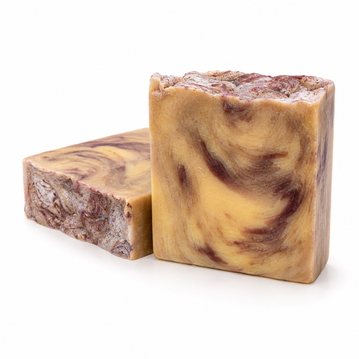 Gilded Plum handcrafted beef tallow soap with a light brown base, dark plum accents and gold streaks.