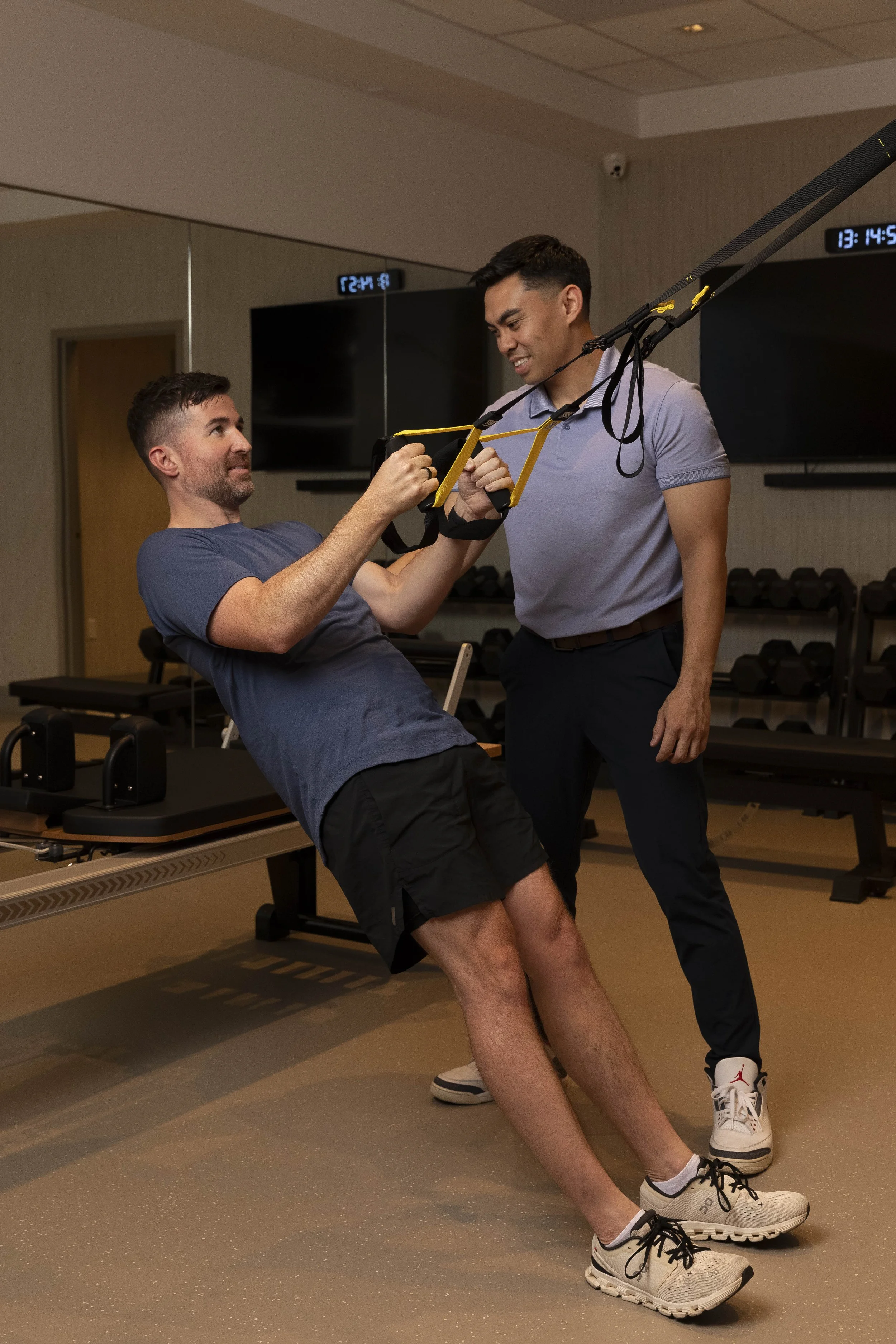 personal trainer guiding a patient through resistance training and functional movement at Estetica Wellness in Las Vegas
