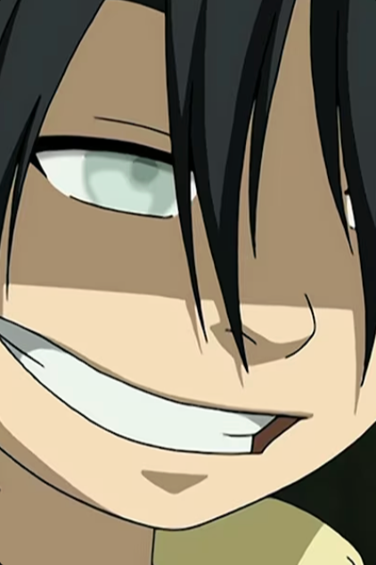 Close-up of an animated character with a mischievous grin, dark hair partially covering one eye, and greenish eyes.